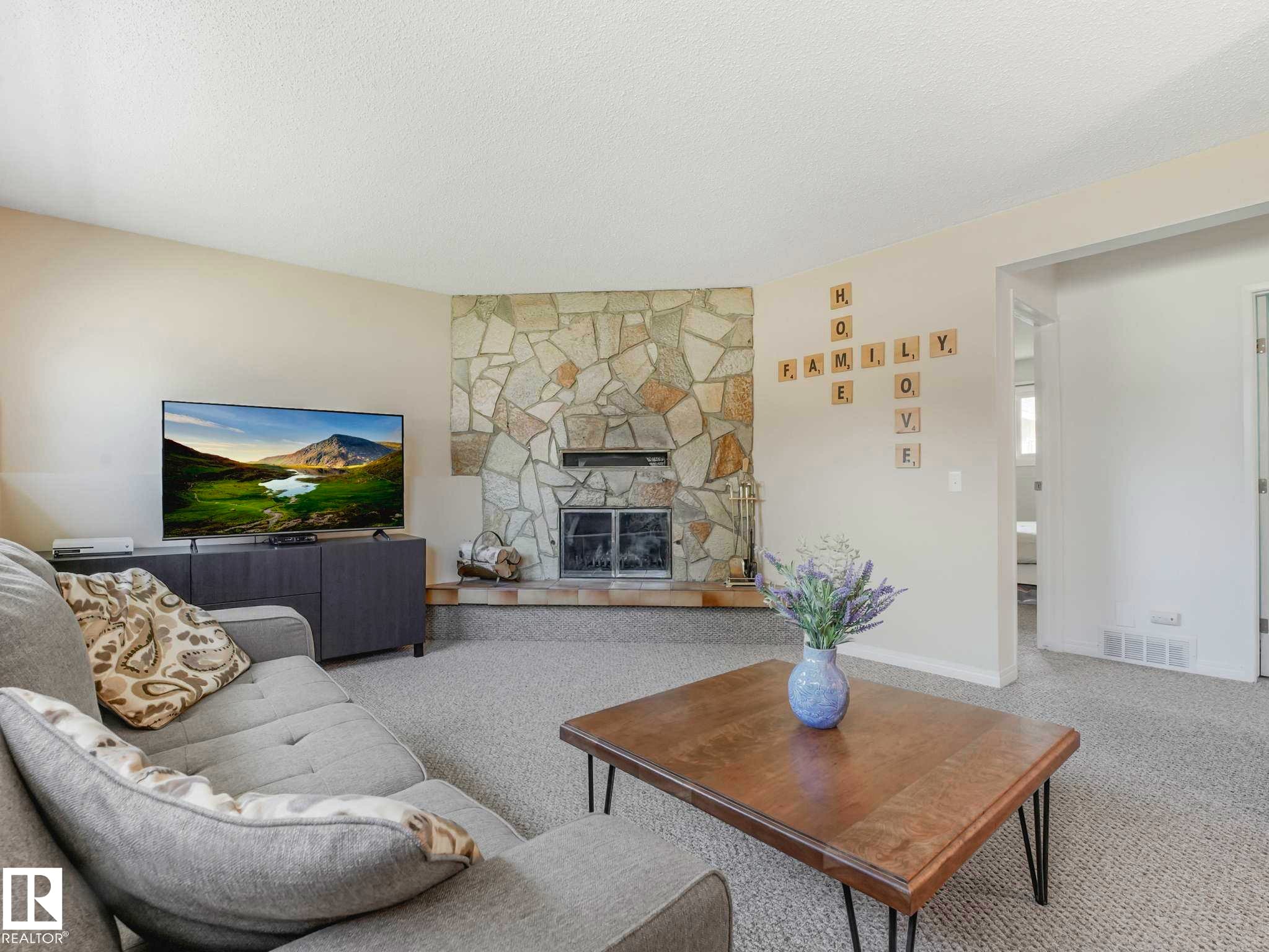 6011 37 Avenue, Edmonton, AB - Indoor Photo Showing Living Room With Fireplace