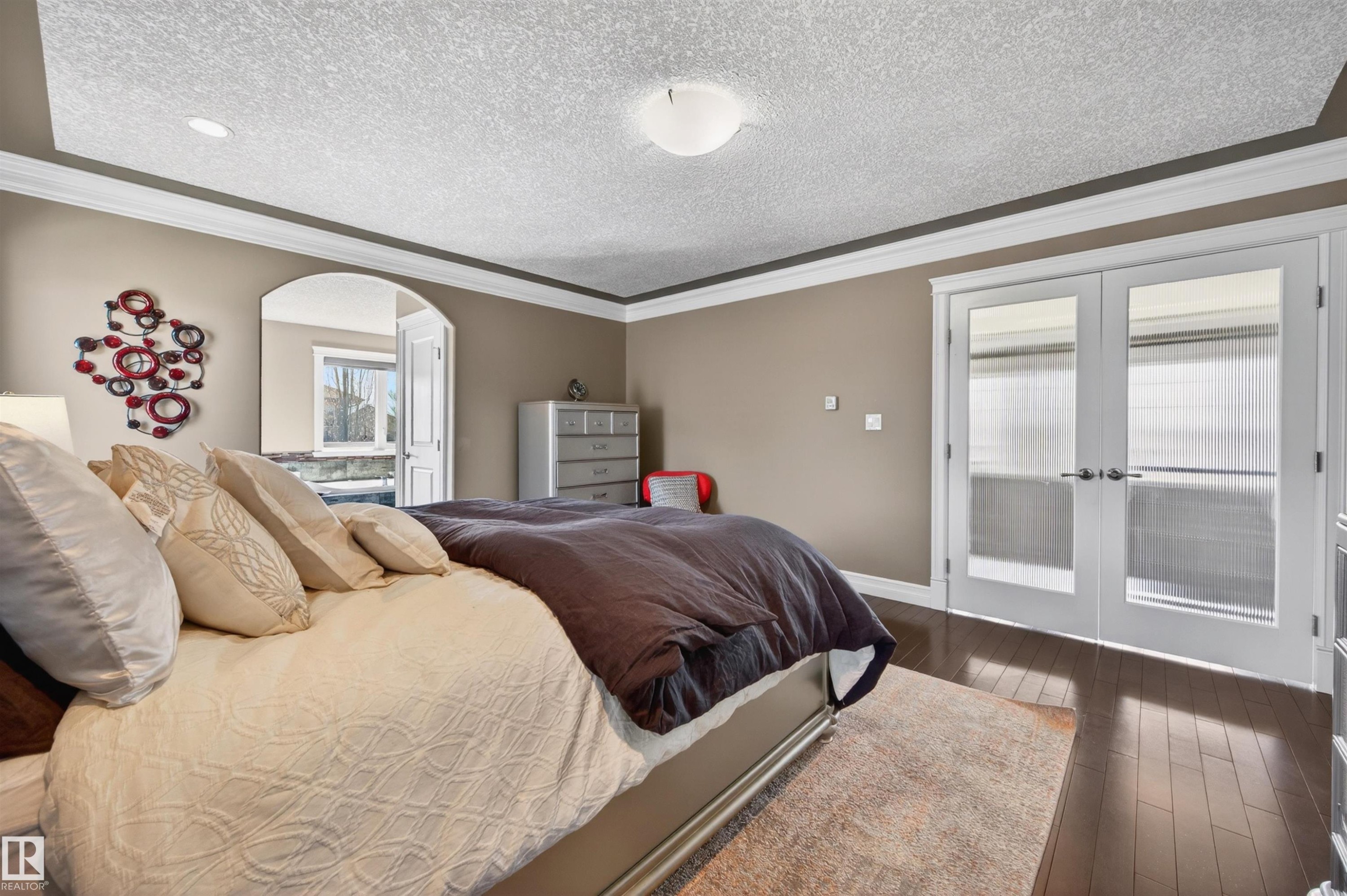 Hardwood-style flooring and crown molding - 1254 Adamson Drive, Edmonton, AB - Indoor Photo Showing Bedroom