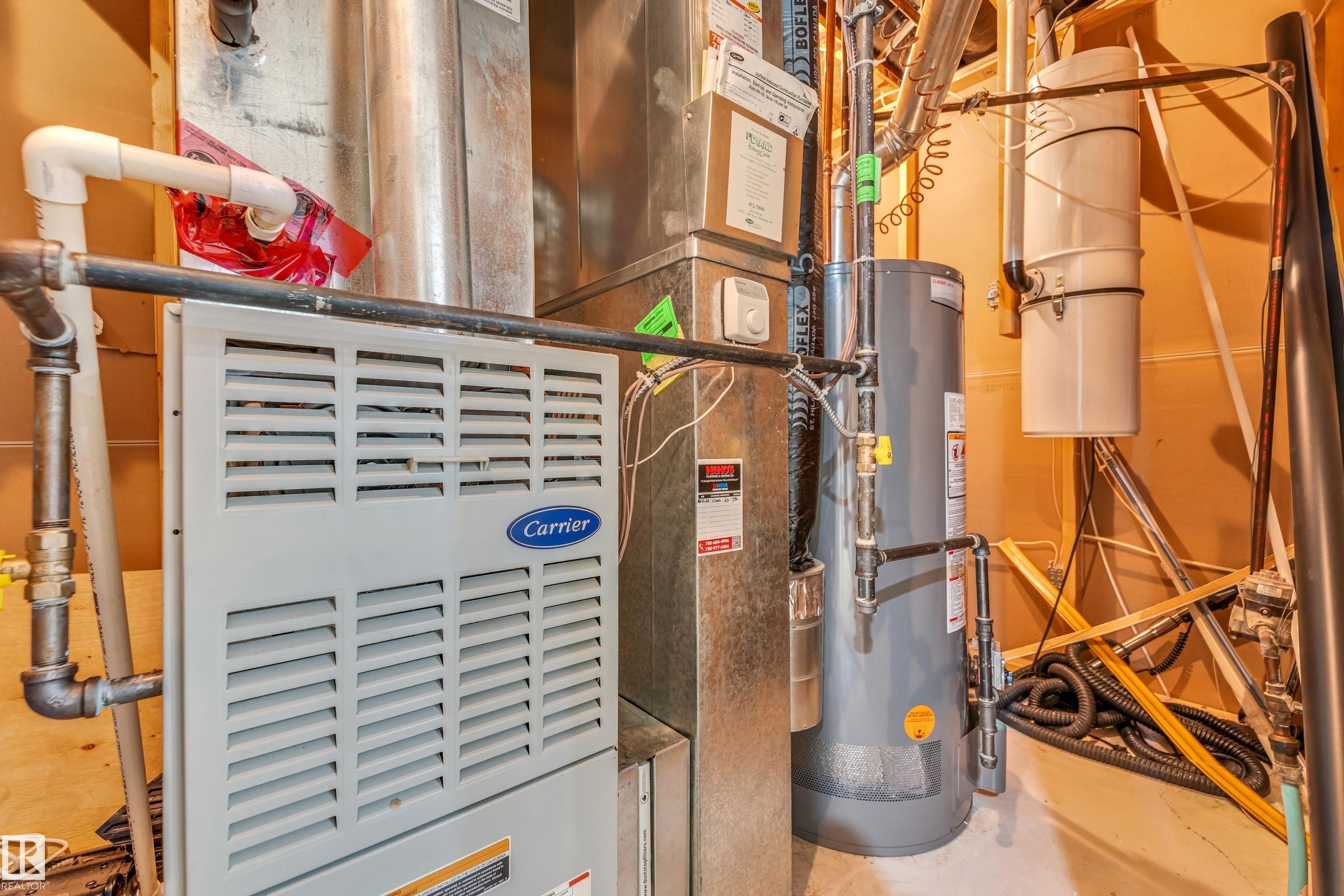 Carrier furnace, water heater, and central vacuum system comprise the mechanical space - 10621 175A Avenue, Edmonton, AB