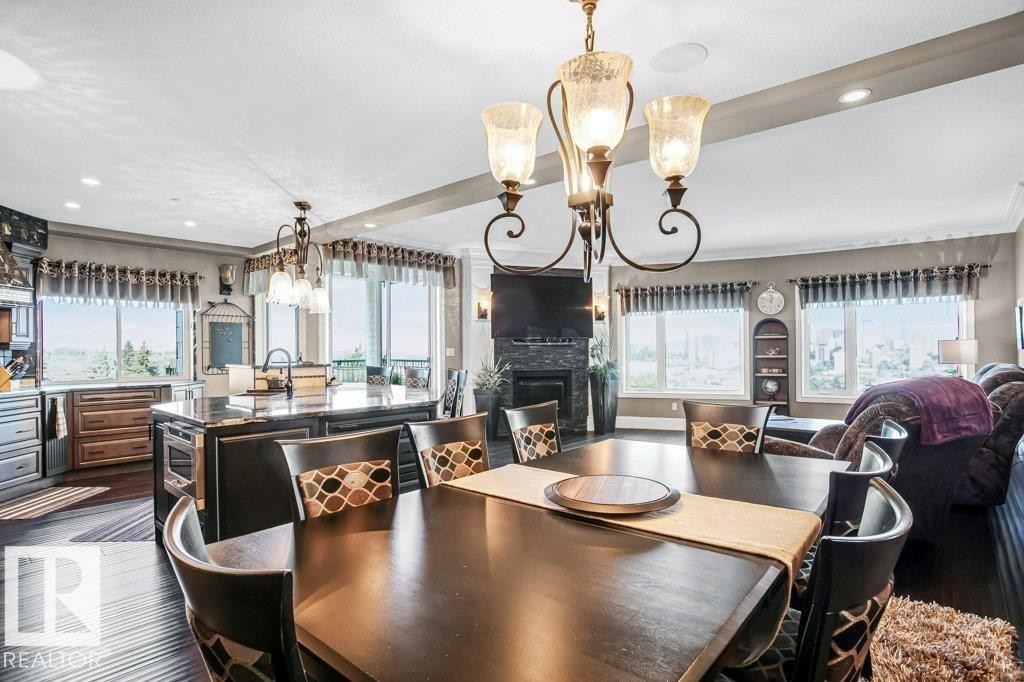 602 8728 Gateway Boulevard, Edmonton, AB - Indoor Photo Showing Dining Room With Fireplace