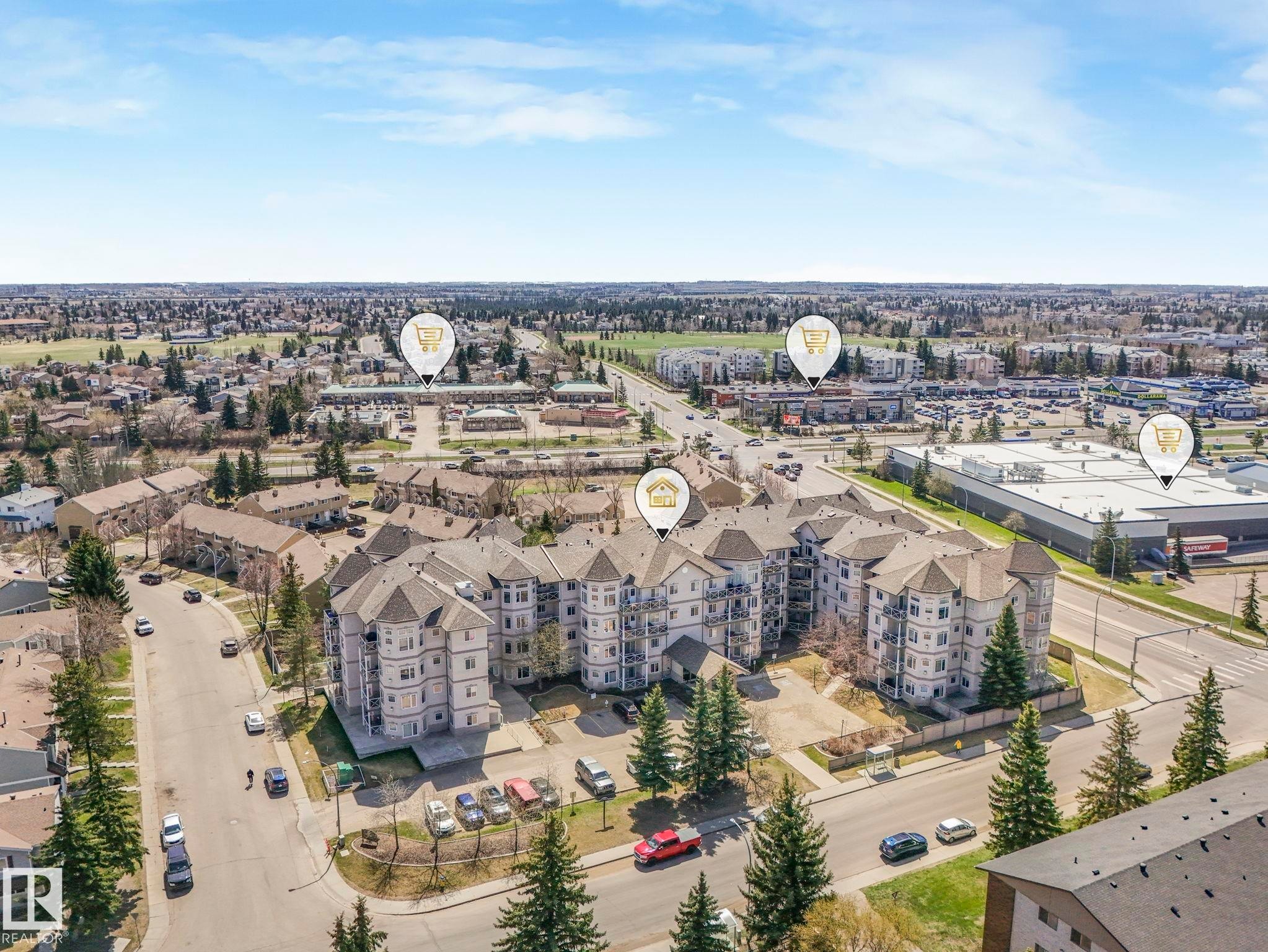 Multi-story building featuring light-toned siding and multiple balconies - 317 2420 108 Street, Edmonton, AB - Outdoor With View