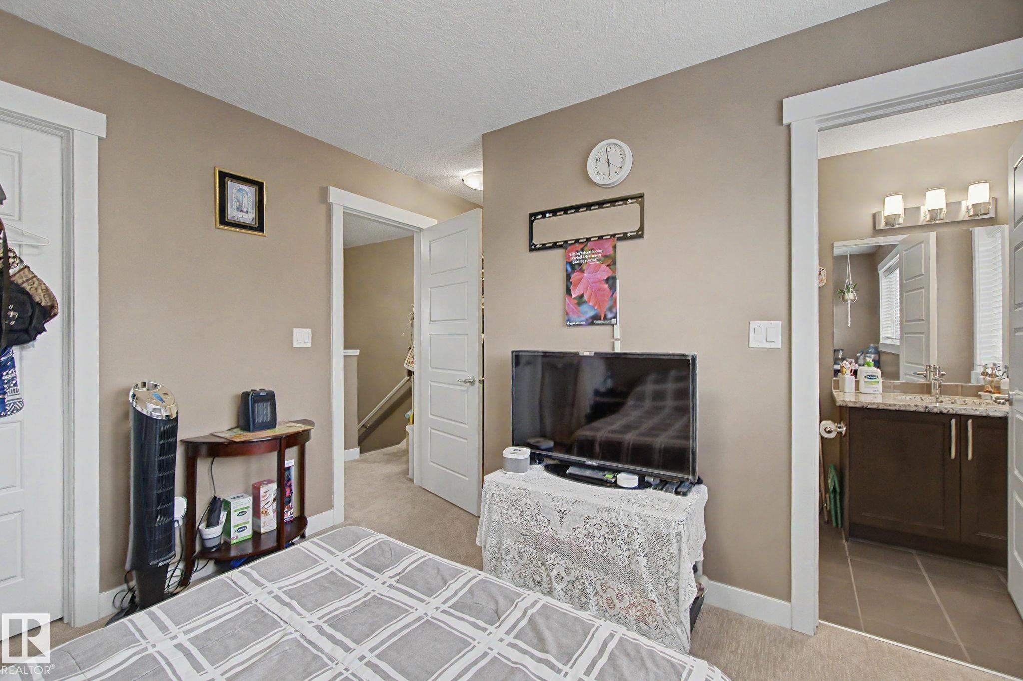 Neutral-toned walls complement white trim and doors - 210 401 Southfork Drive, Leduc, AB - Indoor