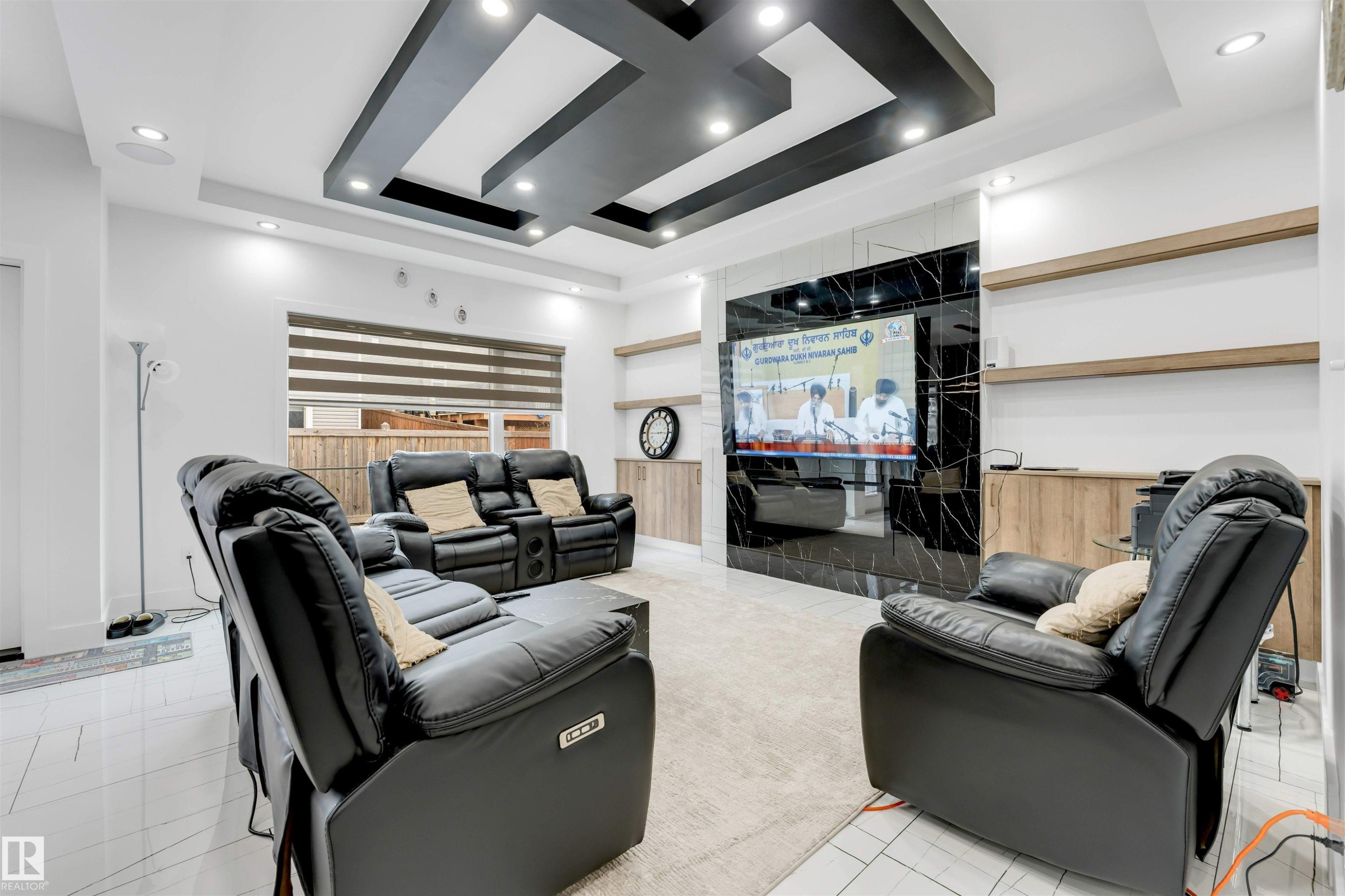Contemporary living area featuring a ceiling with recessed lighting and a striking black and white accent - 1827 17 Avenue, Edmonton, AB - Indoor