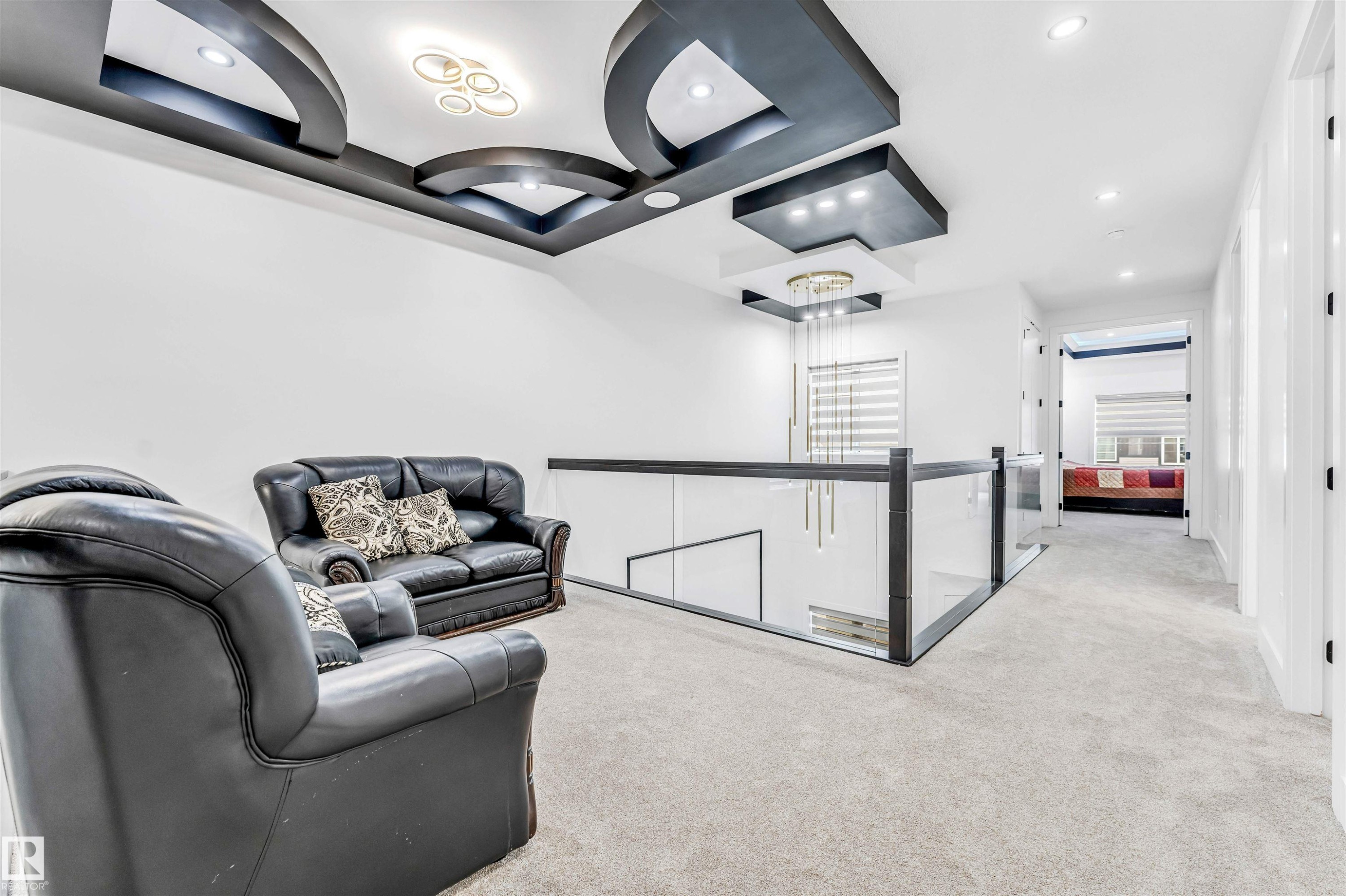 Upper-level landing featuring a contemporary recessed ceiling design with integrated lighting - 1827 17 Avenue, Edmonton, AB - Indoor