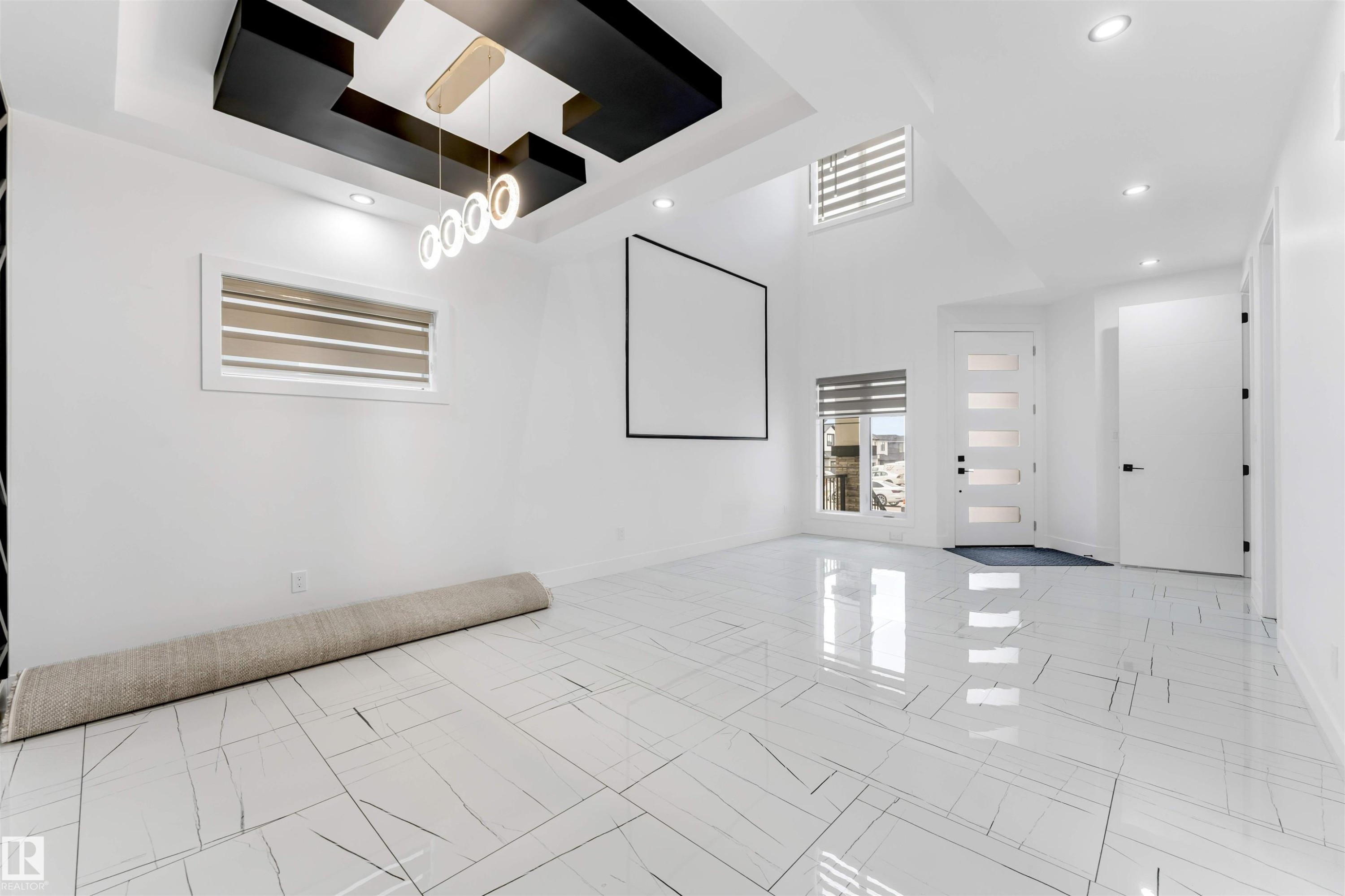 Spacious interior featuring high ceilings and glossy tile flooring - 1827 17 Avenue, Edmonton, AB - Indoor Photo Showing Other Room