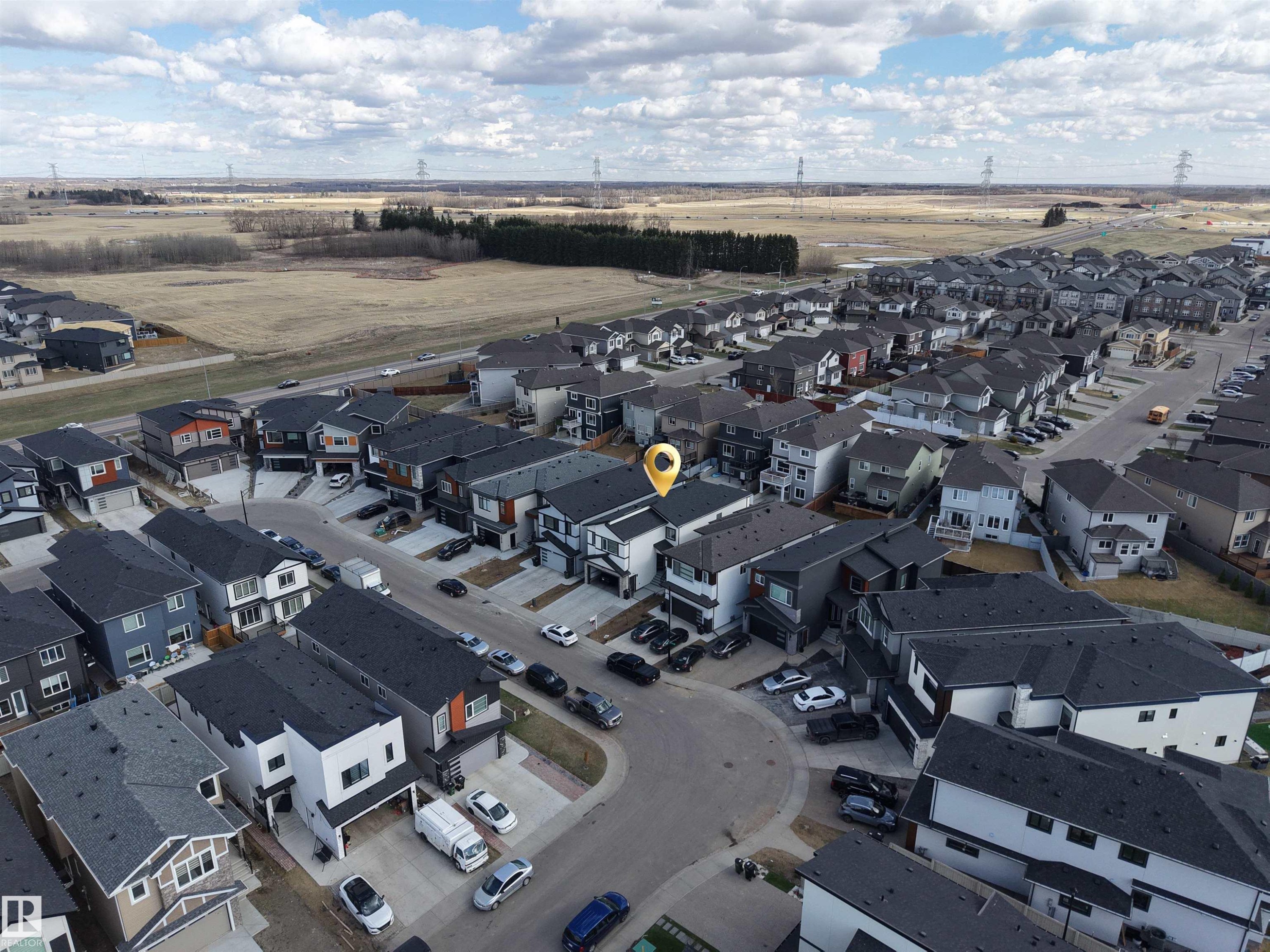 Aerial perspective of a contemporary residential development featuring modern architecture and a curvilinear street layout - 1827 17 Avenue, Edmonton, AB - Outdoor With View