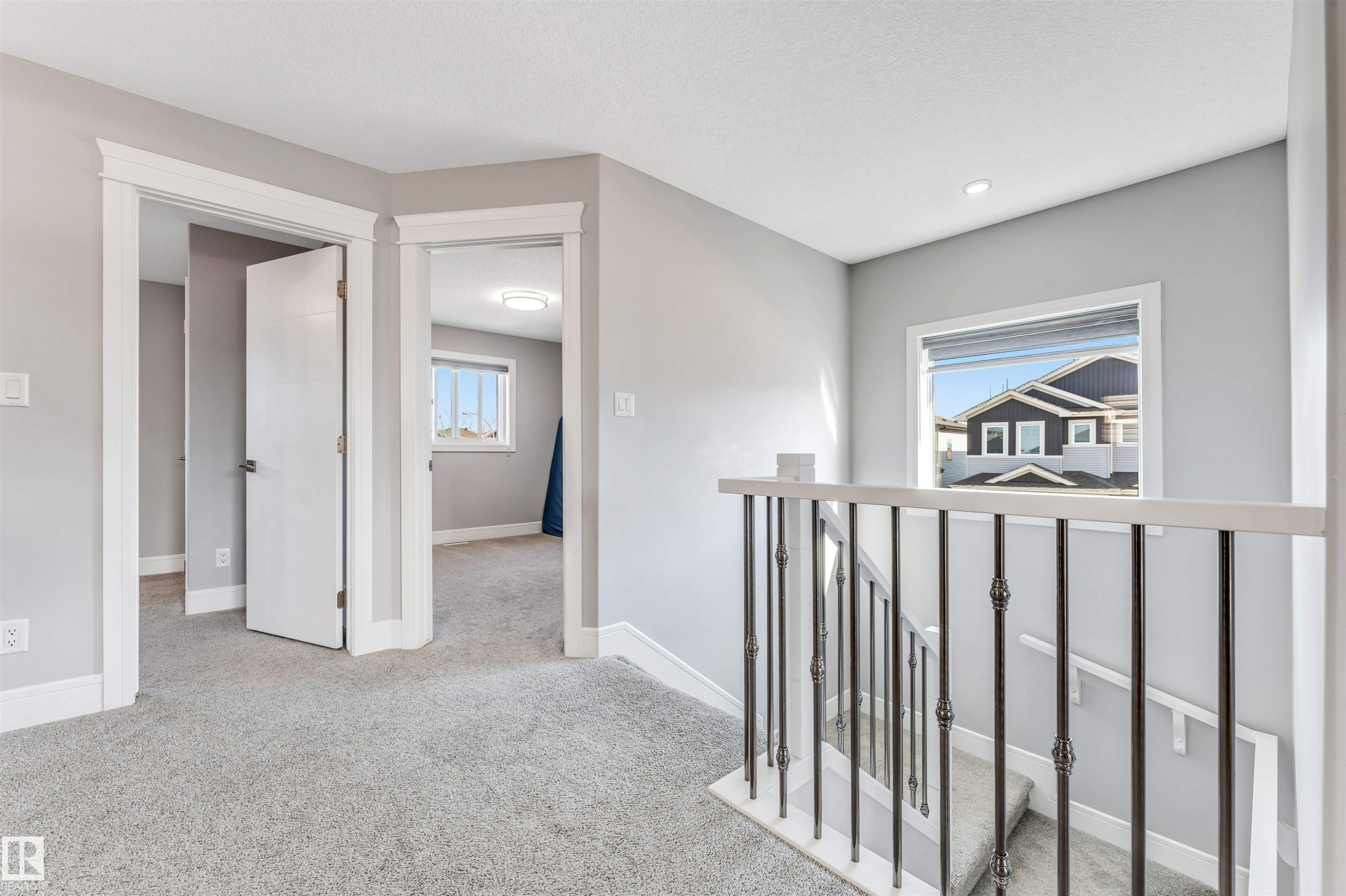 Upper-level landing featuring light gray carpeting and walls - 1103 29 Street, Edmonton, AB - Indoor Photo Showing Other Room