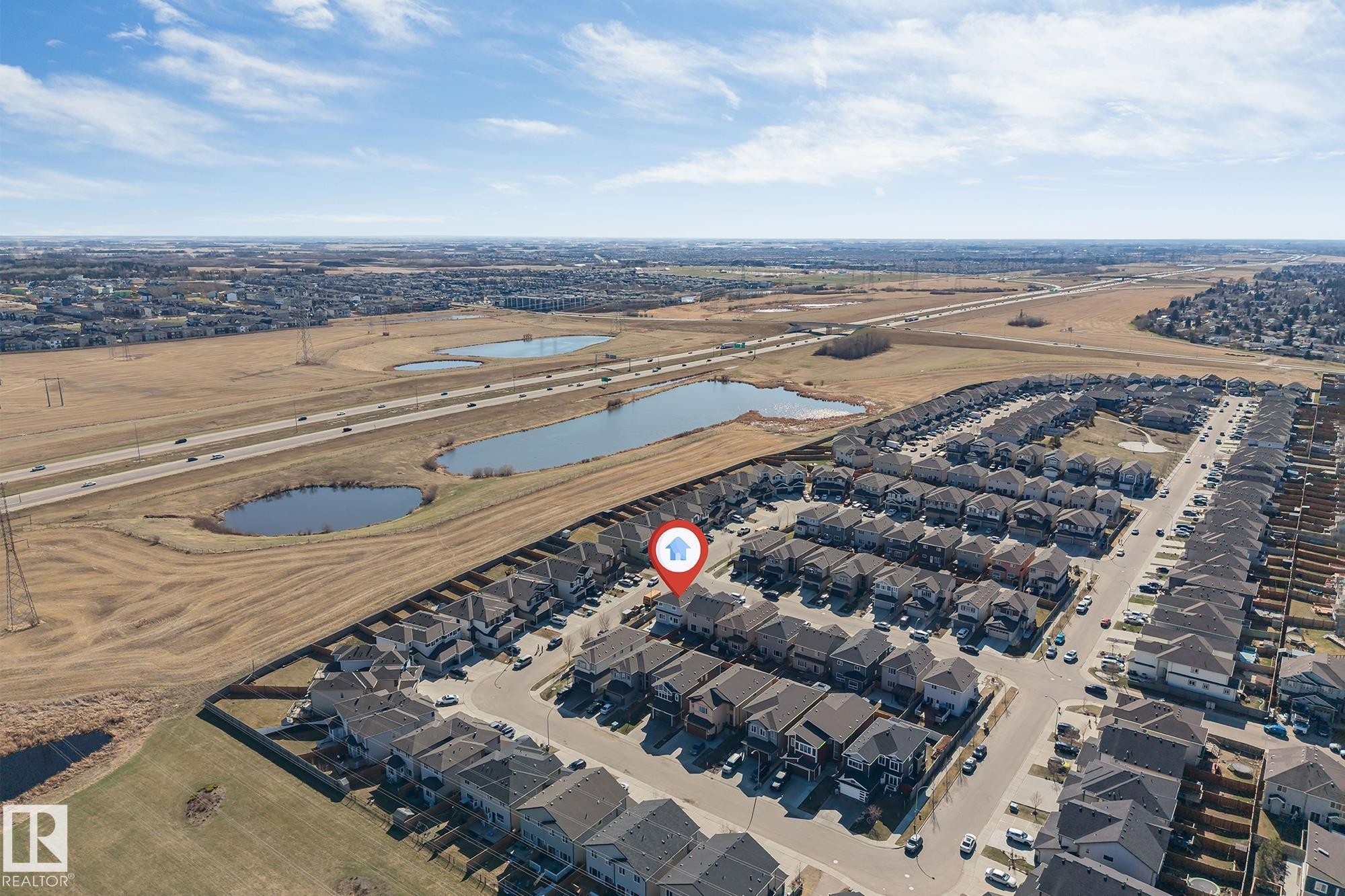 Aerial view of a residential community featuring a network of streets and numerous detached and attached homes - 1103 29 Street, Edmonton, AB - Outdoor With View