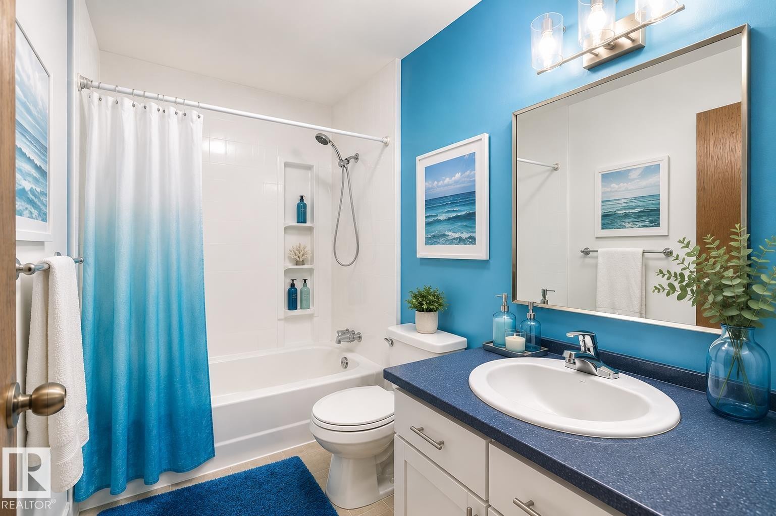 Bathroom featuring a white vanity with a blue countertop, an oval undermount sink, and a chrome faucet - 17313 60 Avenue, Edmonton, AB - Indoor Photo Showing Bathroom