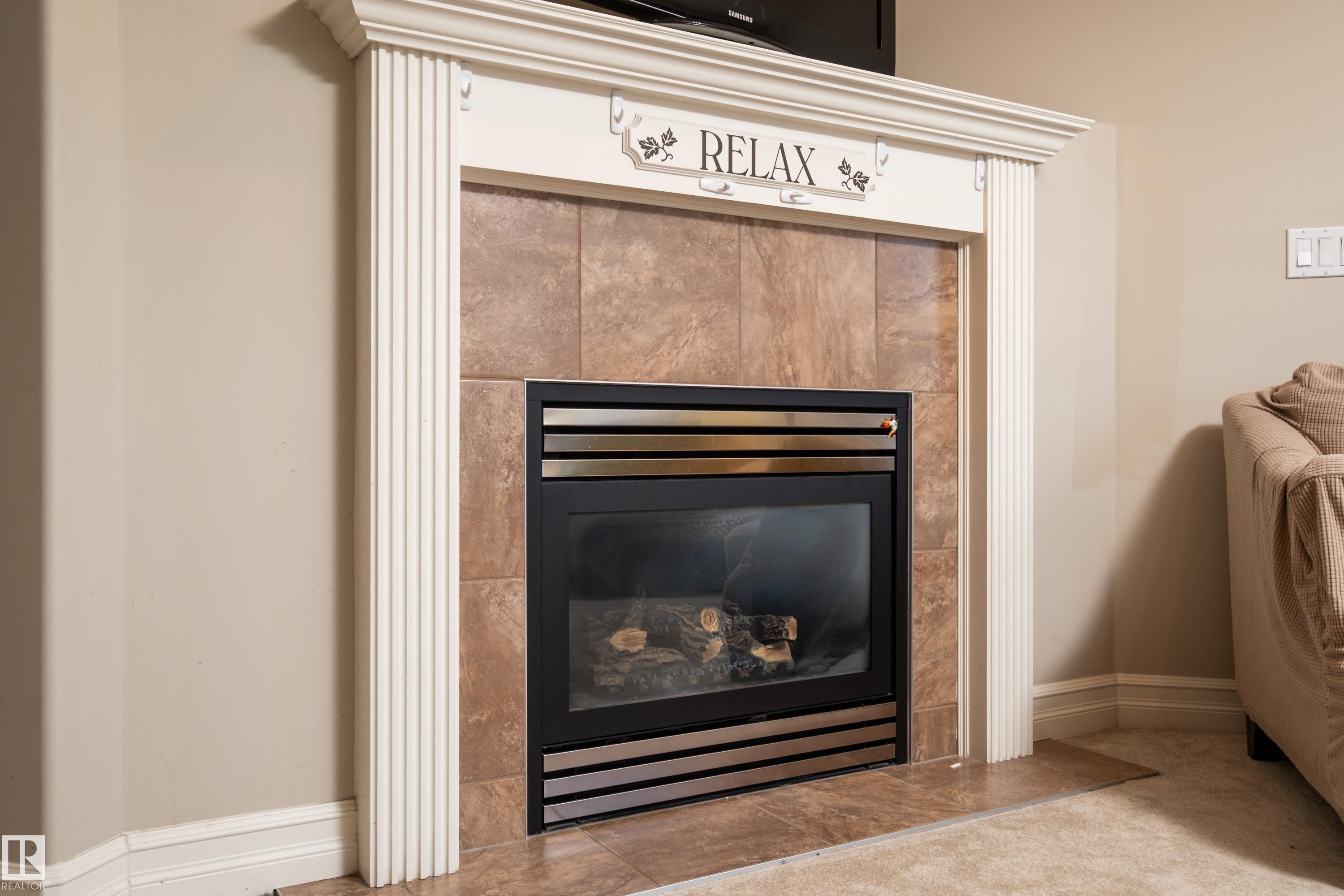 4 Spring Grove Crescent, Spruce Grove, AB - Indoor Photo Showing Living Room With Fireplace