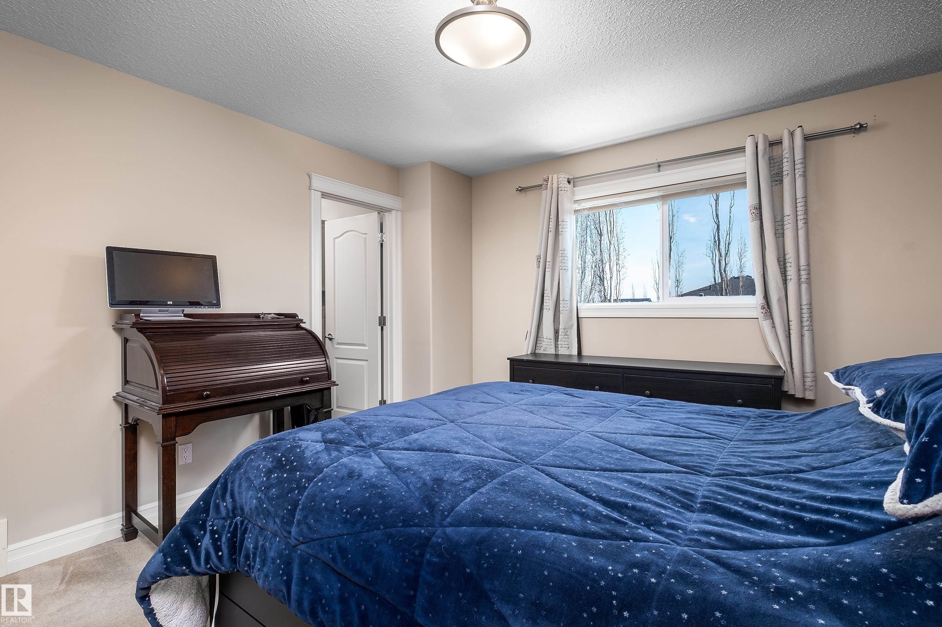 4 Spring Grove Crescent, Spruce Grove, AB - Indoor Photo Showing Bedroom