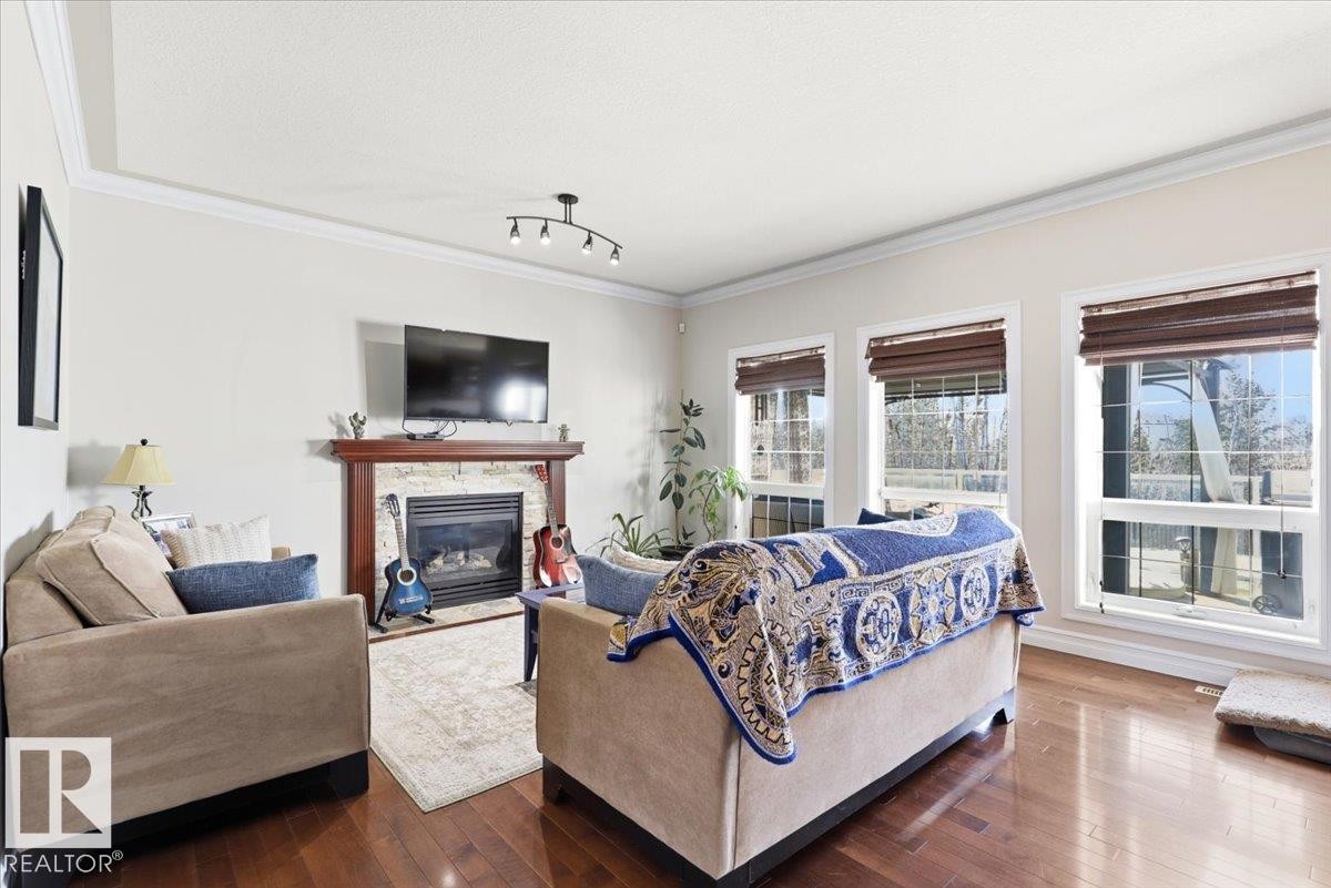 30 Ravine Drive, Devon, AB - Indoor Photo Showing Living Room With Fireplace