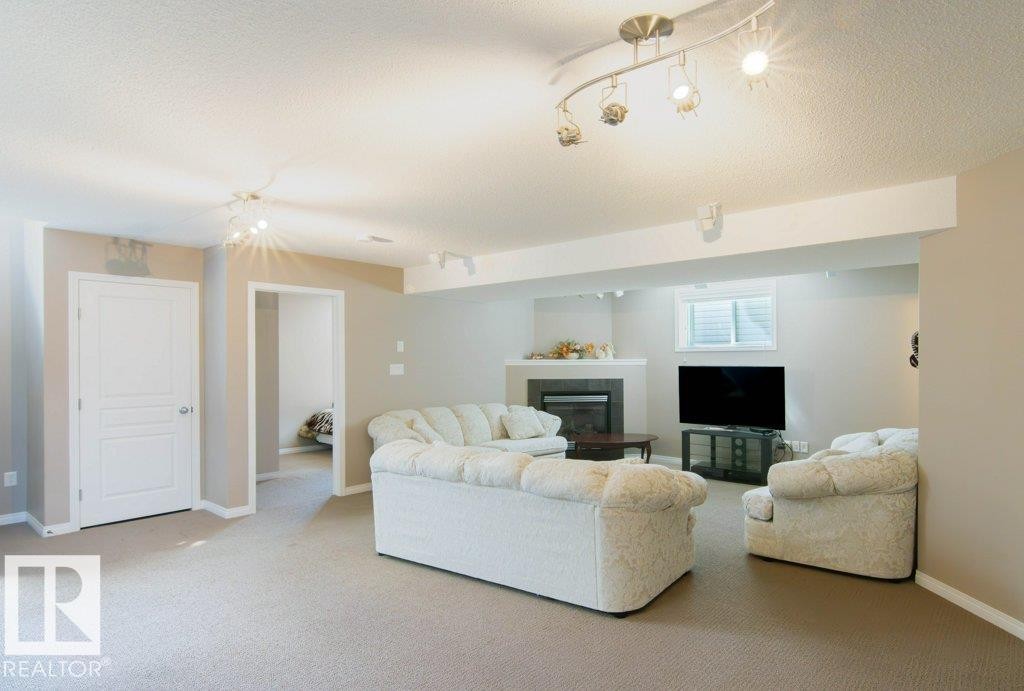 6103 5 Avenue, Edmonton, AB - Indoor Photo Showing Living Room With Fireplace