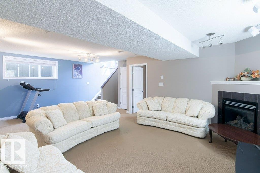 6103 5 Avenue, Edmonton, AB - Indoor Photo Showing Living Room With Fireplace