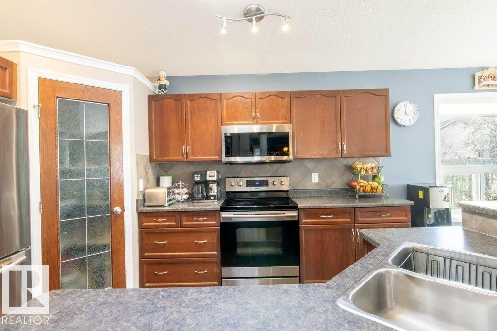 6103 5 Avenue, Edmonton, AB - Indoor Photo Showing Kitchen With Double Sink