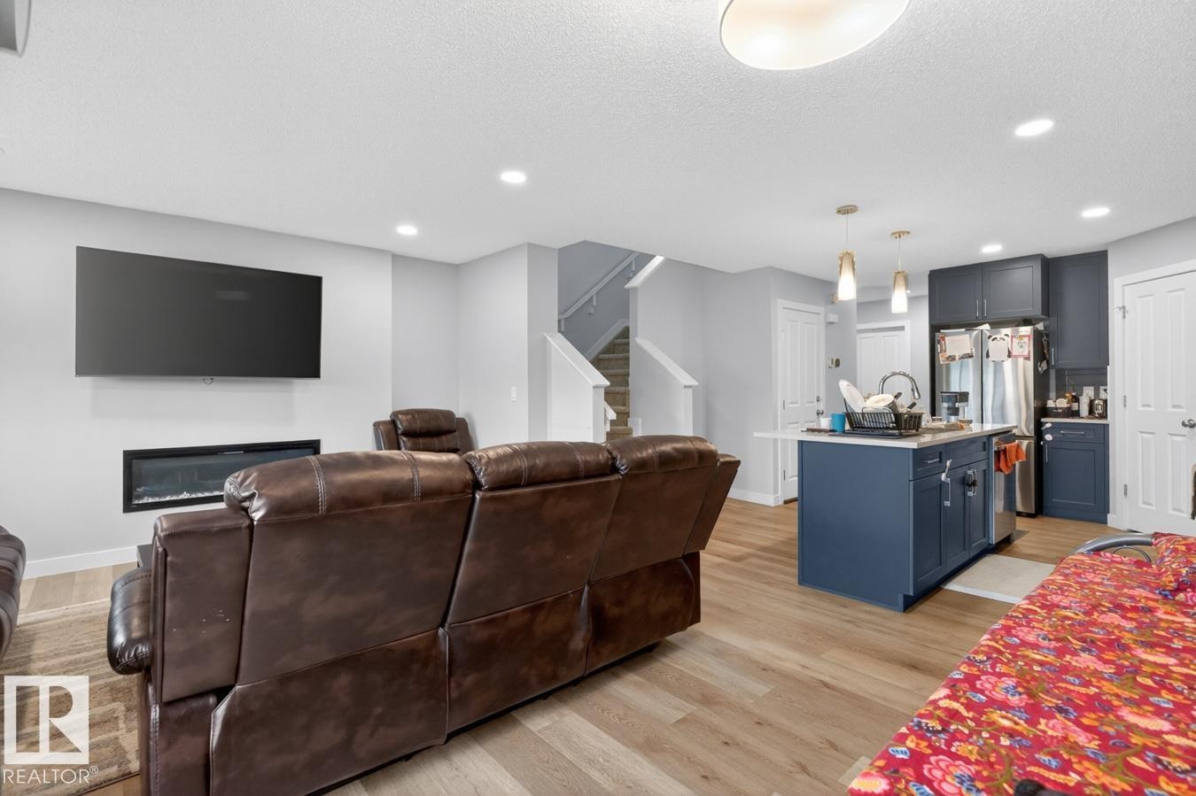 Open-concept living space with wood-finish flooring - 3214 9 Street, Edmonton, AB - Indoor