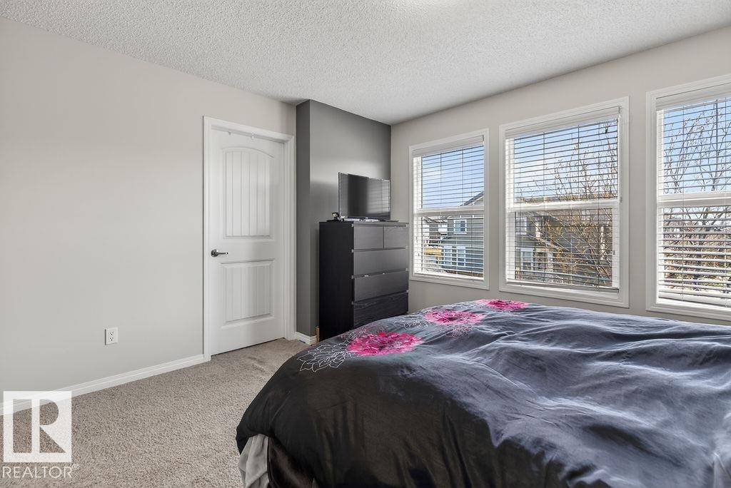 Bright bedroom with neutral wall paint - 17540 58 Street Nw, Edmonton, AB