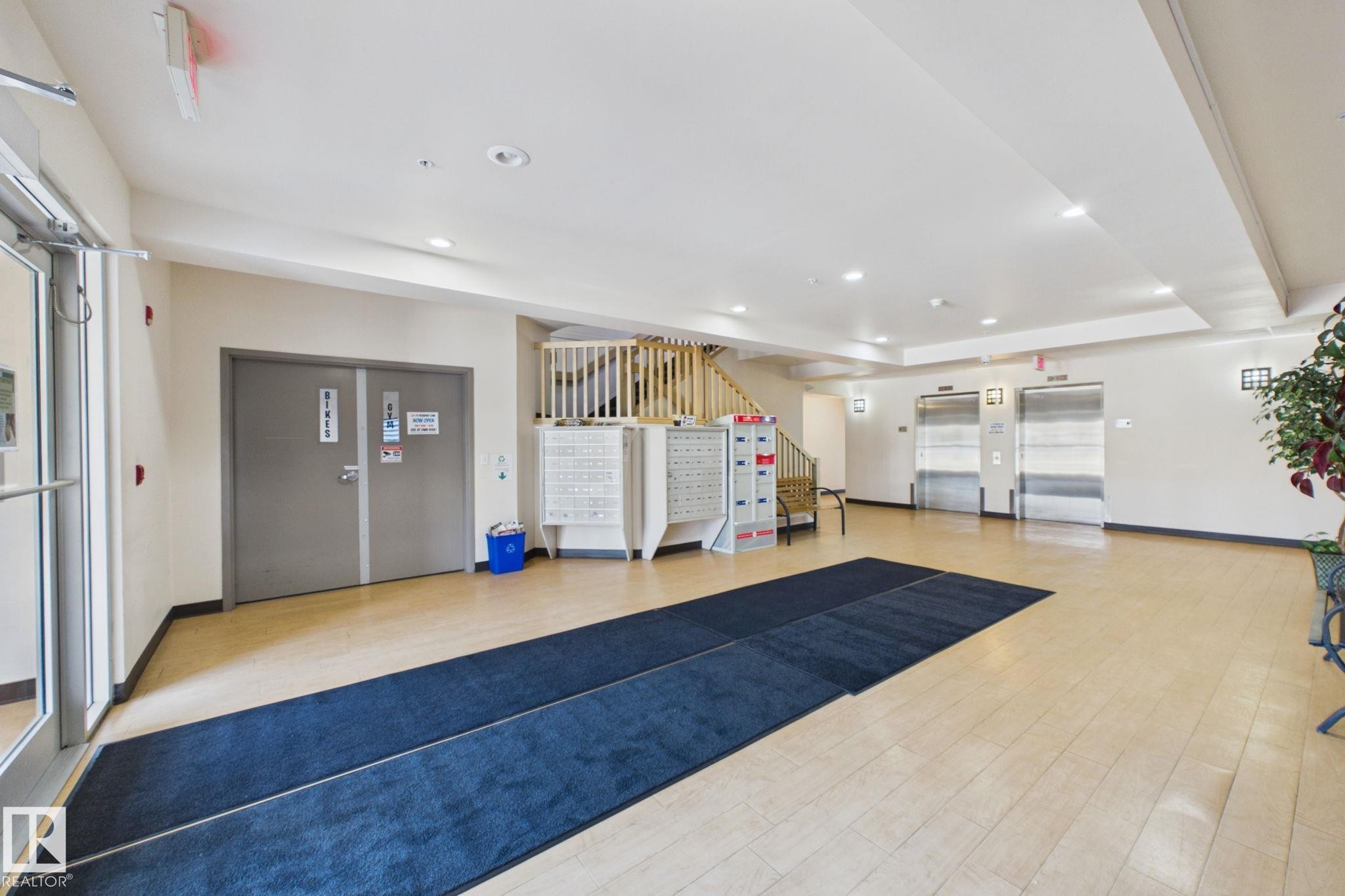 Entry foyer featuring light-toned flooring and recessed ceiling lights - 220 80A Kelloway Crescent, Red Deer, AB - Indoor Photo Showing Other Room