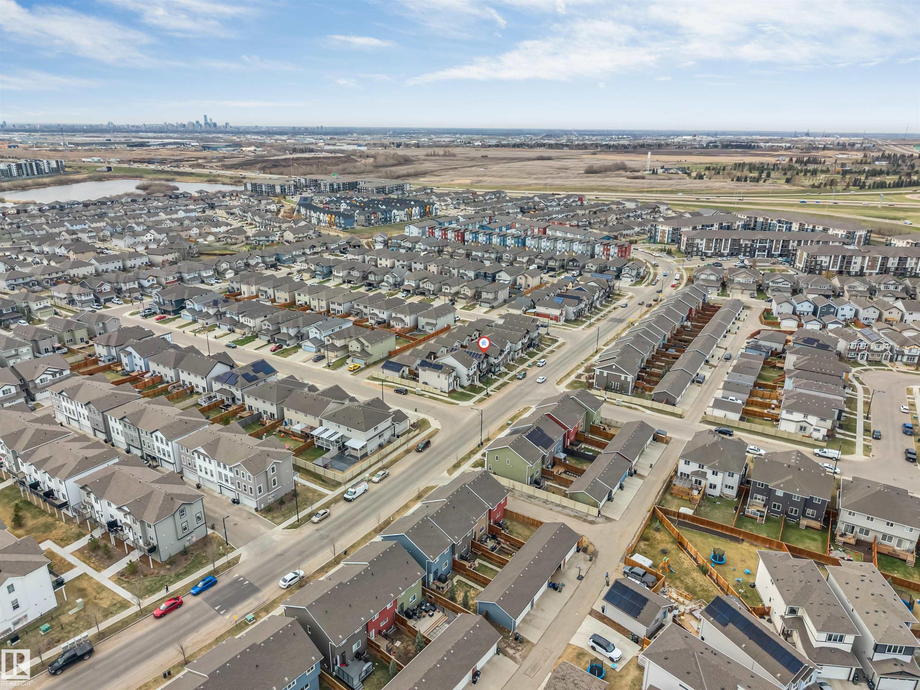Aerial perspective showcasing a residential community with diverse housing styles - 2652 Maple Way, Edmonton, AB - Outdoor With View