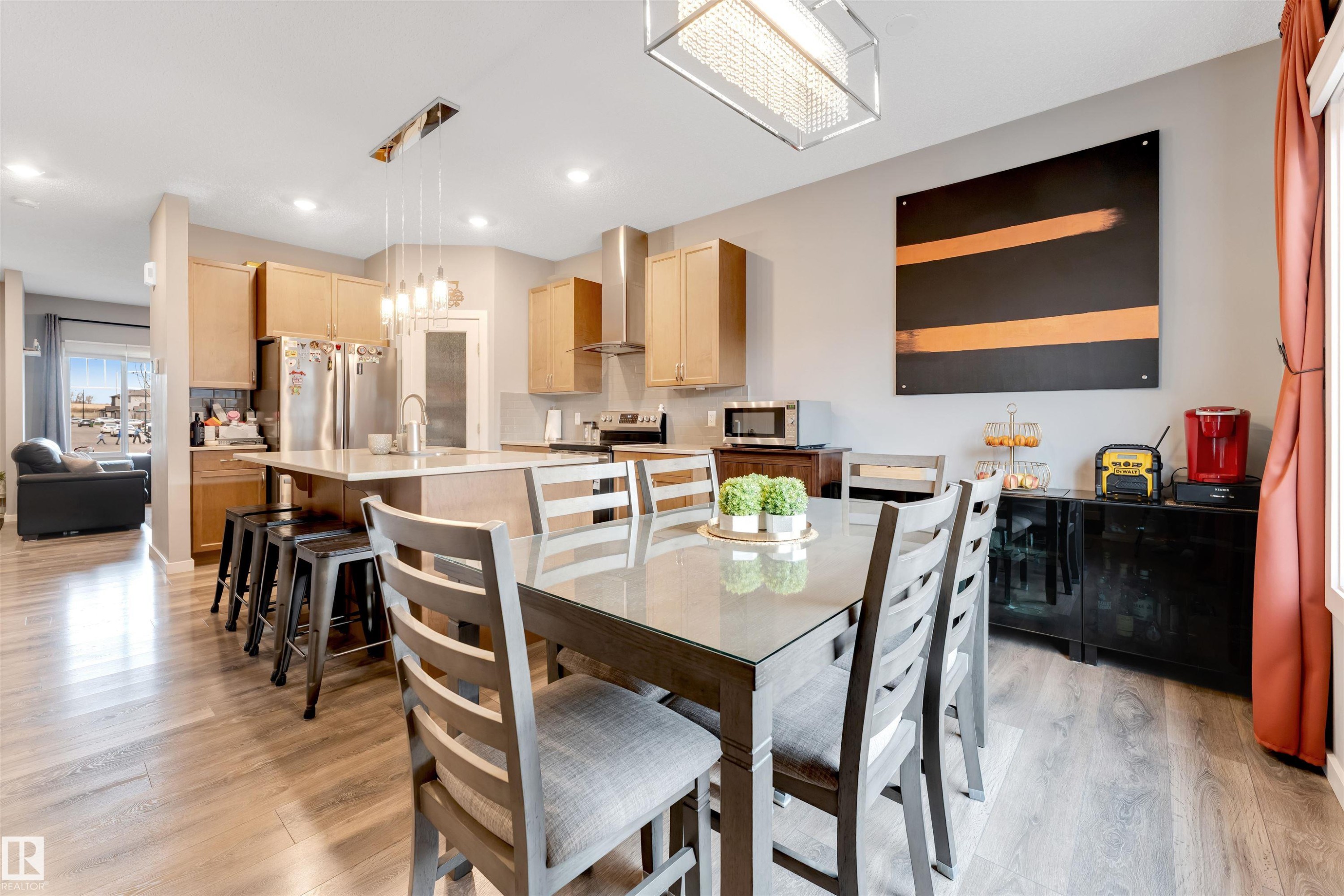 Open-concept kitchen and dining area featuring wood-finish flooring - 2652 Maple Way, Edmonton, AB - Indoor Photo Showing Dining Room