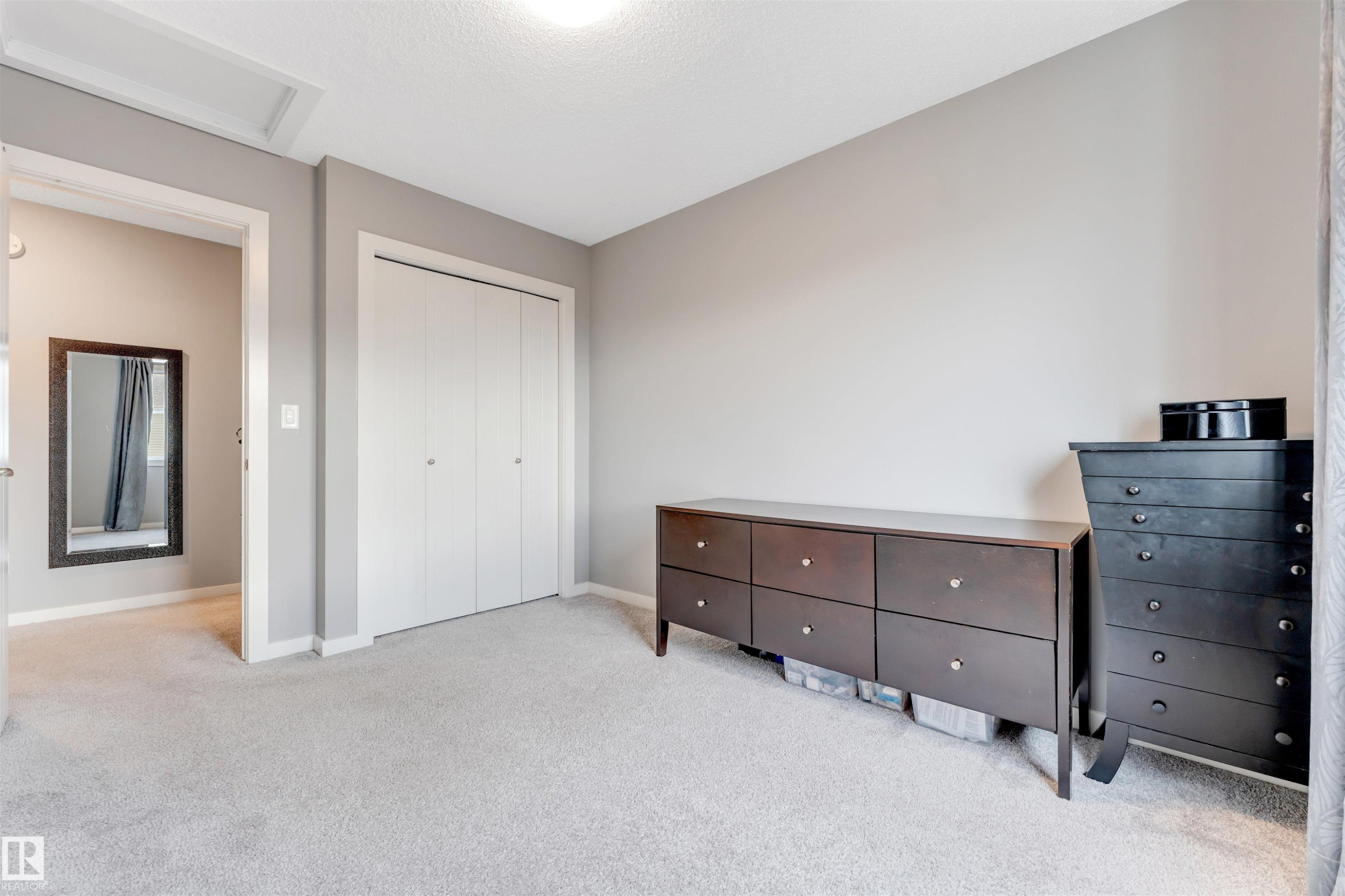 Soft gray wall tones with white trim throughout - 2652 Maple Way, Edmonton, AB - Indoor Photo Showing Bedroom