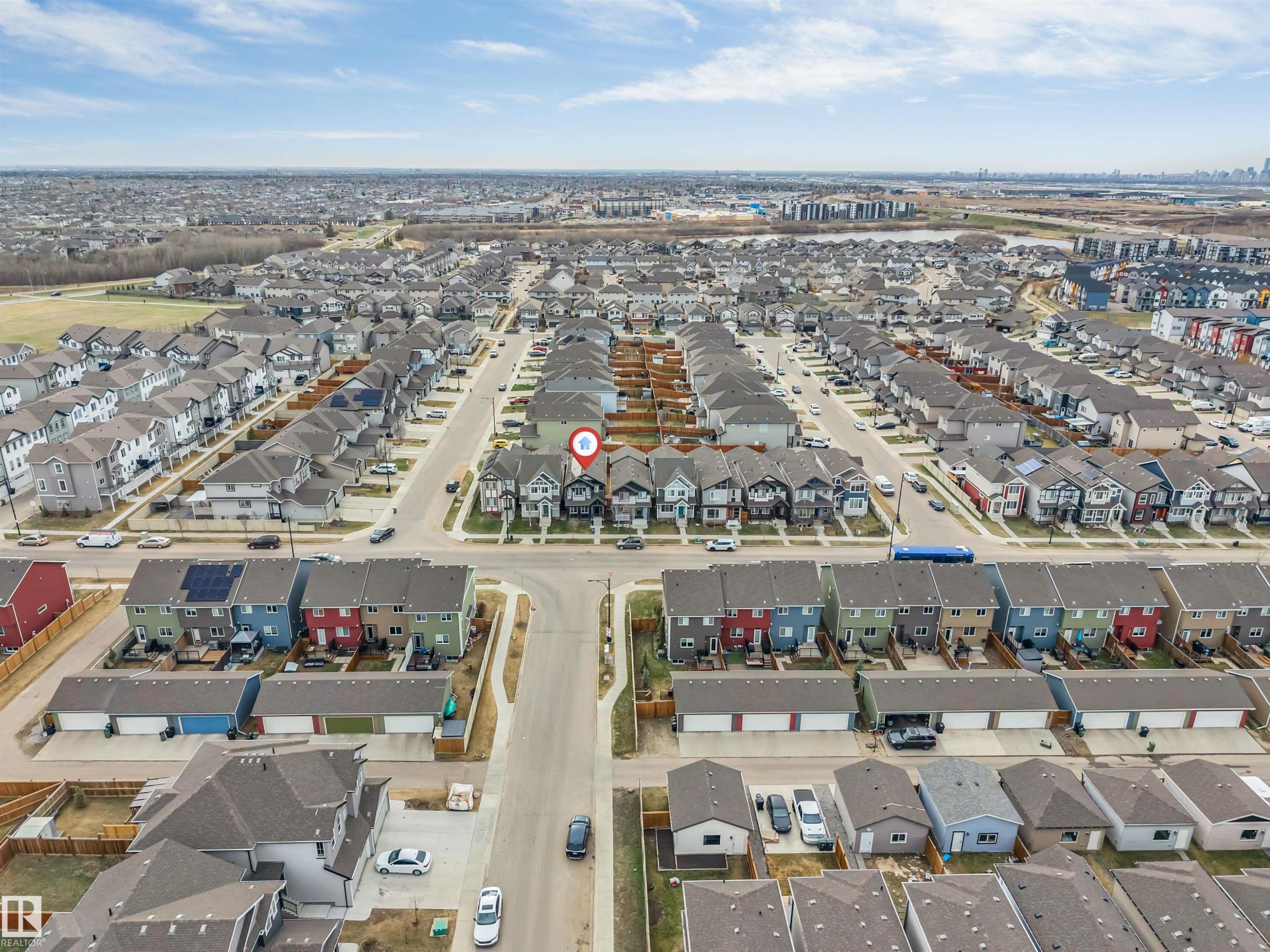 Aerial perspective showcasing a residential development with multiple streets and distinct housing styles - 2652 Maple Way, Edmonton, AB - Outdoor With View