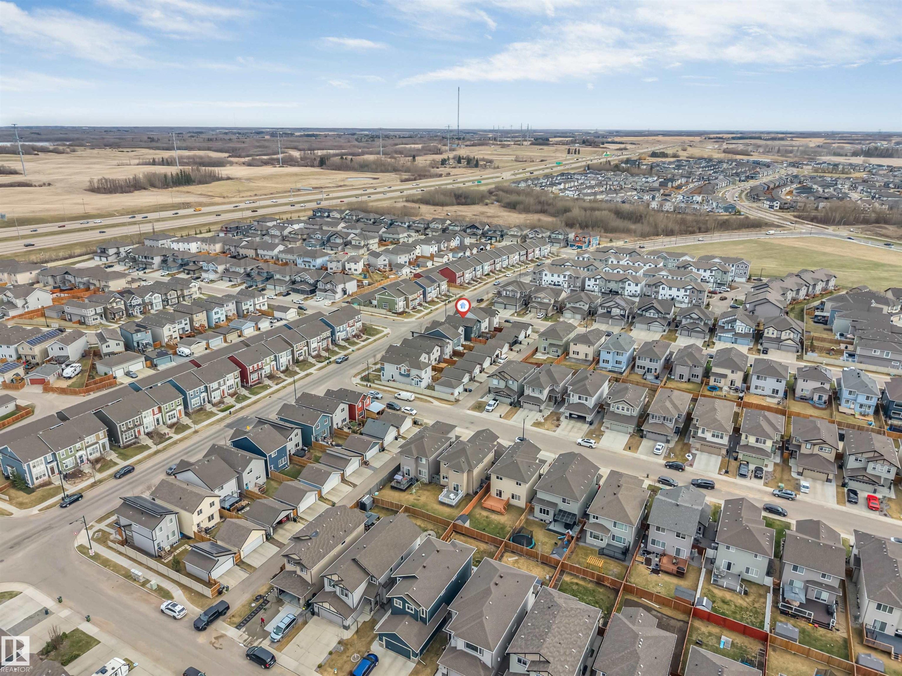 Residential development featuring multiple single-family homes and townhomes with various rooflines and exterior finishes - 2652 Maple Way, Edmonton, AB - Outdoor With View
