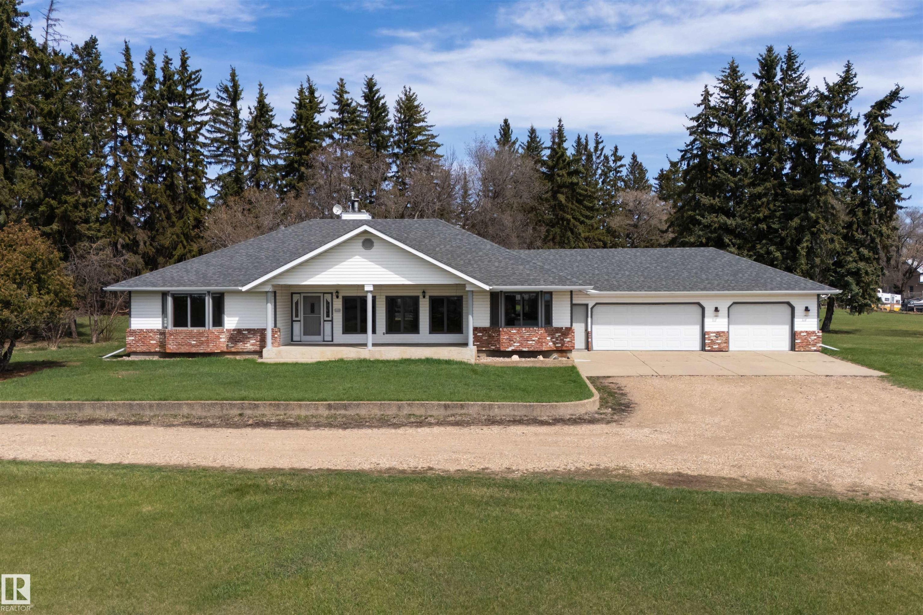 Ranch-style residence featuring a prominent gabled entry and a stone and white siding exterior - 19403 Fort Road, Edmonton, AB - Outdoor With Facade