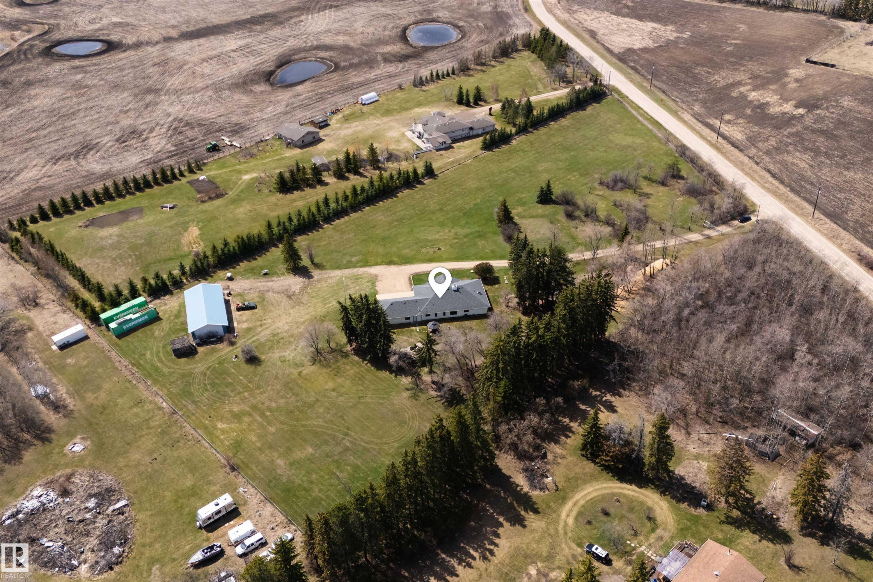 Expansive rural property featuring a single-story residence with a light gray roof - 19403 Fort Road, Edmonton, AB - Outdoor With View