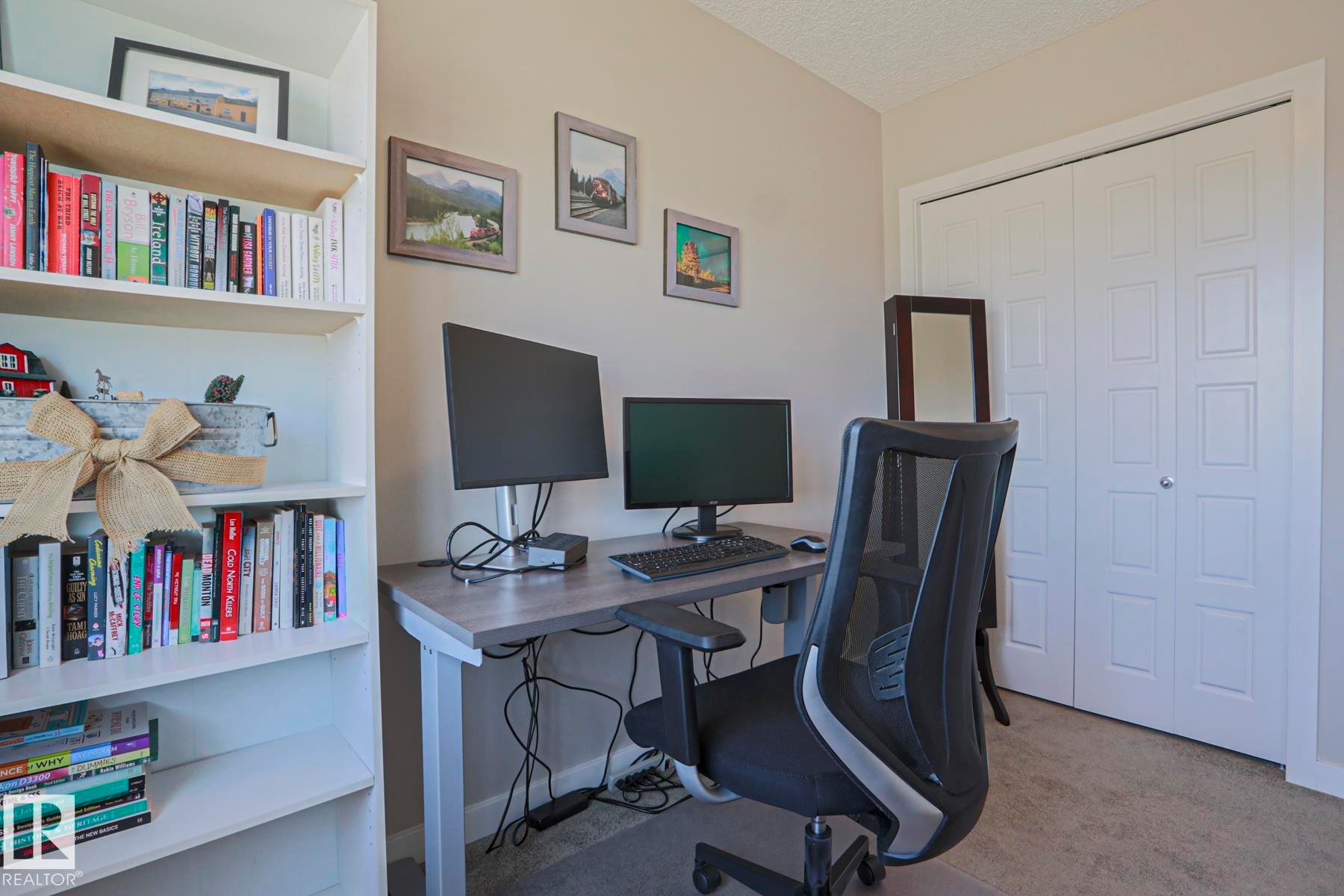 Built-in shelving unit providing extensive storage with lots of room - 1622 33A Street Nw, Edmonton, AB - Indoor Photo Showing Office