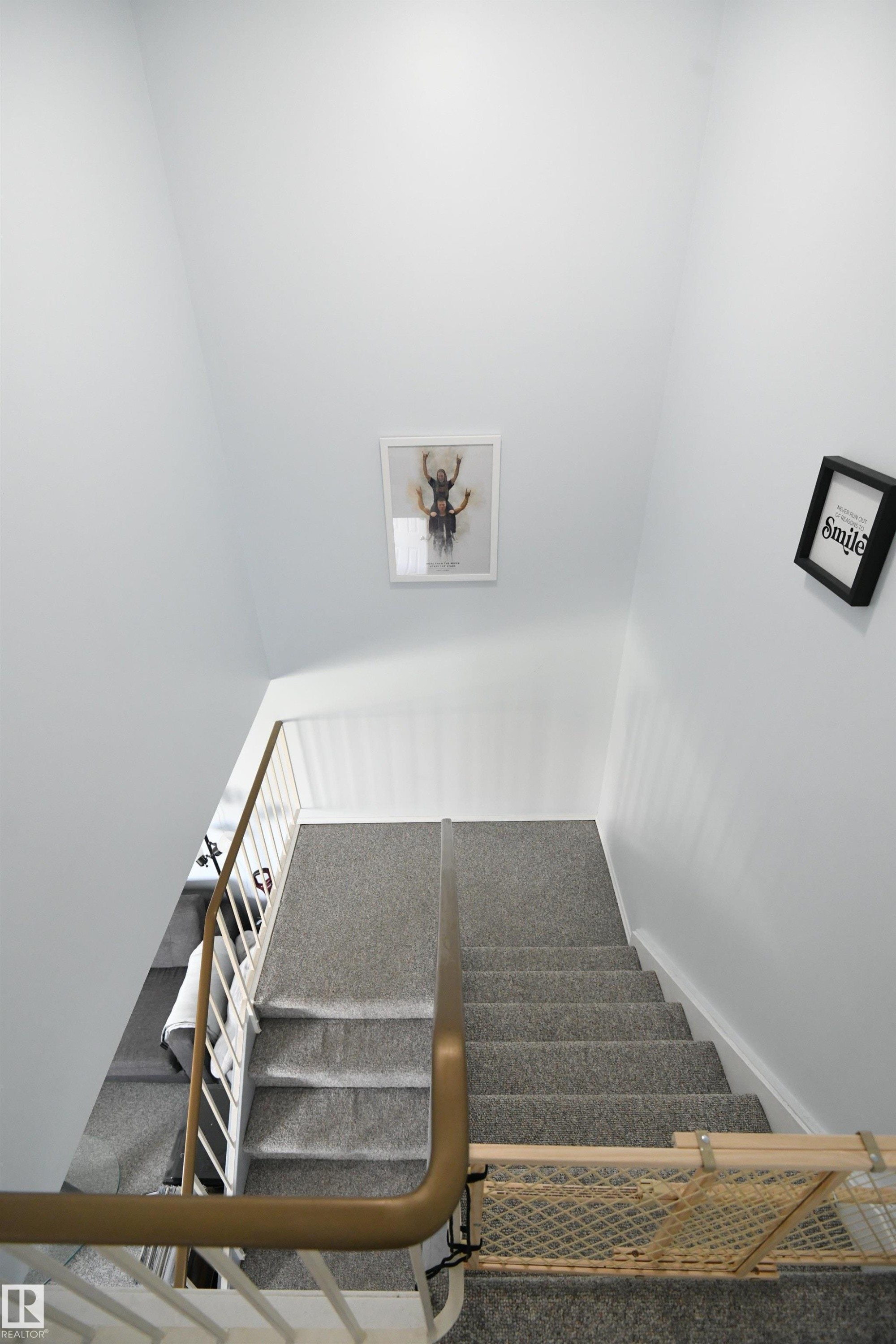 The open railings in the stairway help to open the sight lines, and allow the ample natural light to fill the space. The private, family spaces are all on the top level, leaving the main floor and basement for everyone to enjoy together - 5823 Riverbend Road, Edmonton, AB - Indoor Photo Showing Other Room