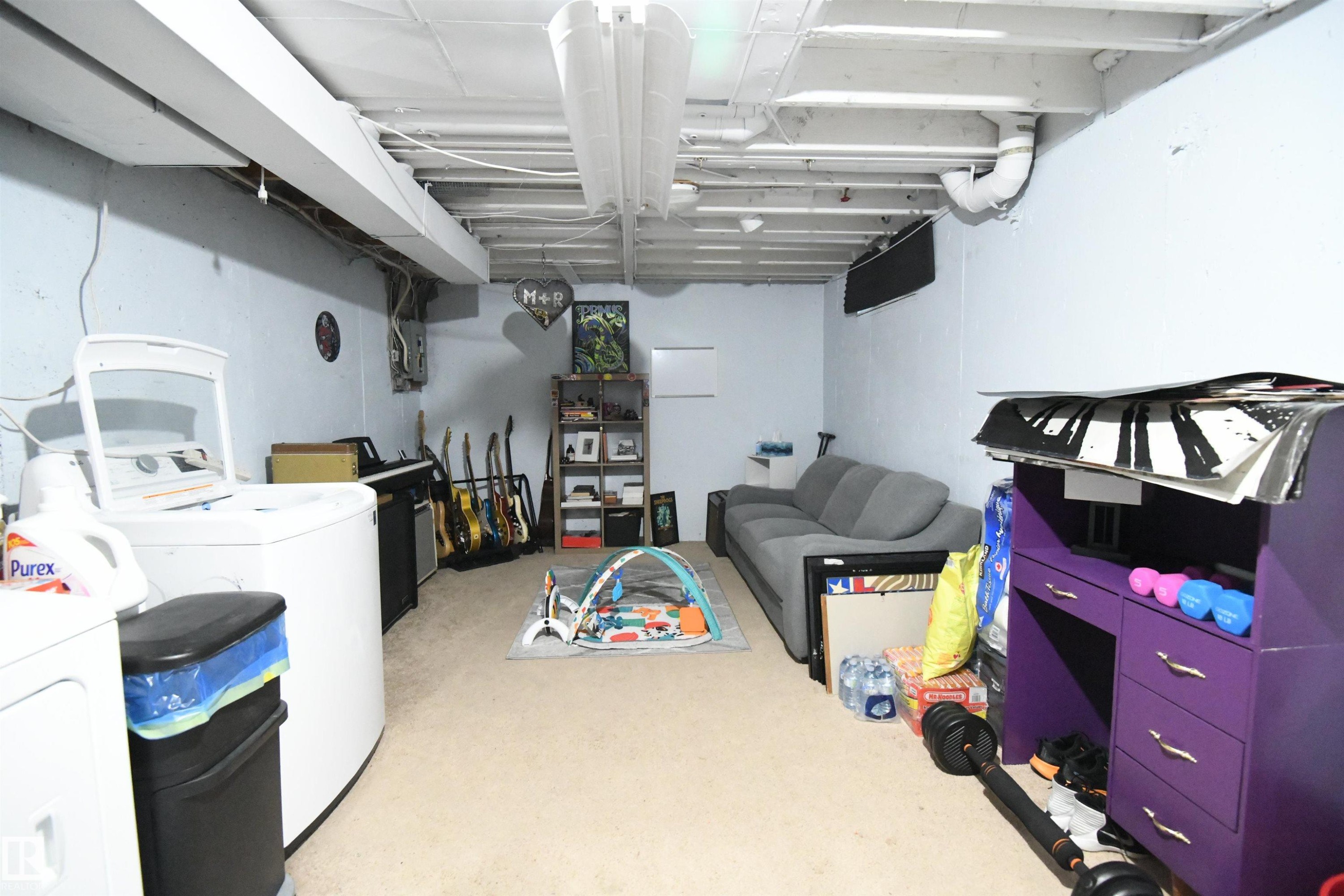 The basement is wide open and ready for your personal touches, if you want to finish out some additional space. The laundry and utilities are conveniently set to the side of the unit, so as not to impede your development plans - 5823 Riverbend Road, Edmonton, AB - Indoor Photo Showing Laundry Room