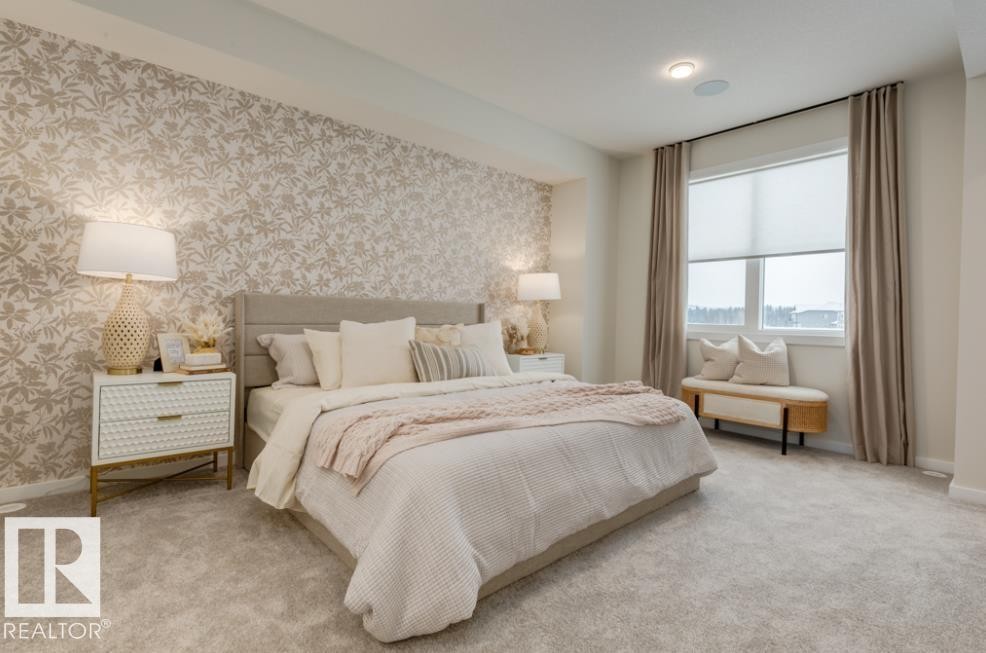 Bedroom featuring an accent wall with botanical-patterned wallpaper, light-toned carpeting, recessed lighting, and a large window with roller shades and drapes - 720 Southfork Drive, Leduc, AB - Indoor Photo Showing Bedroom