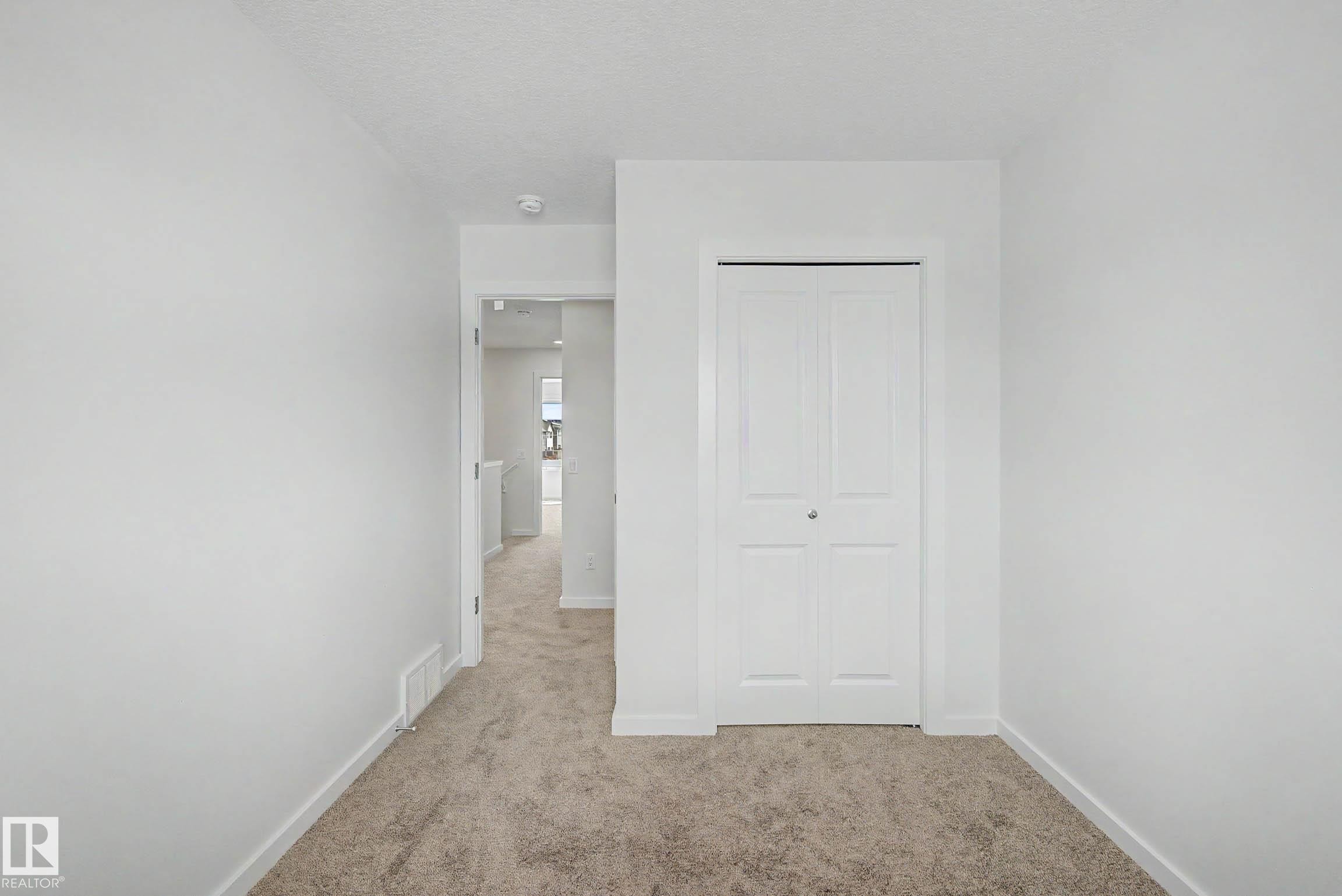 Neutral-toned carpeting throughout - 720 Southfork Drive, Leduc, AB - Indoor
