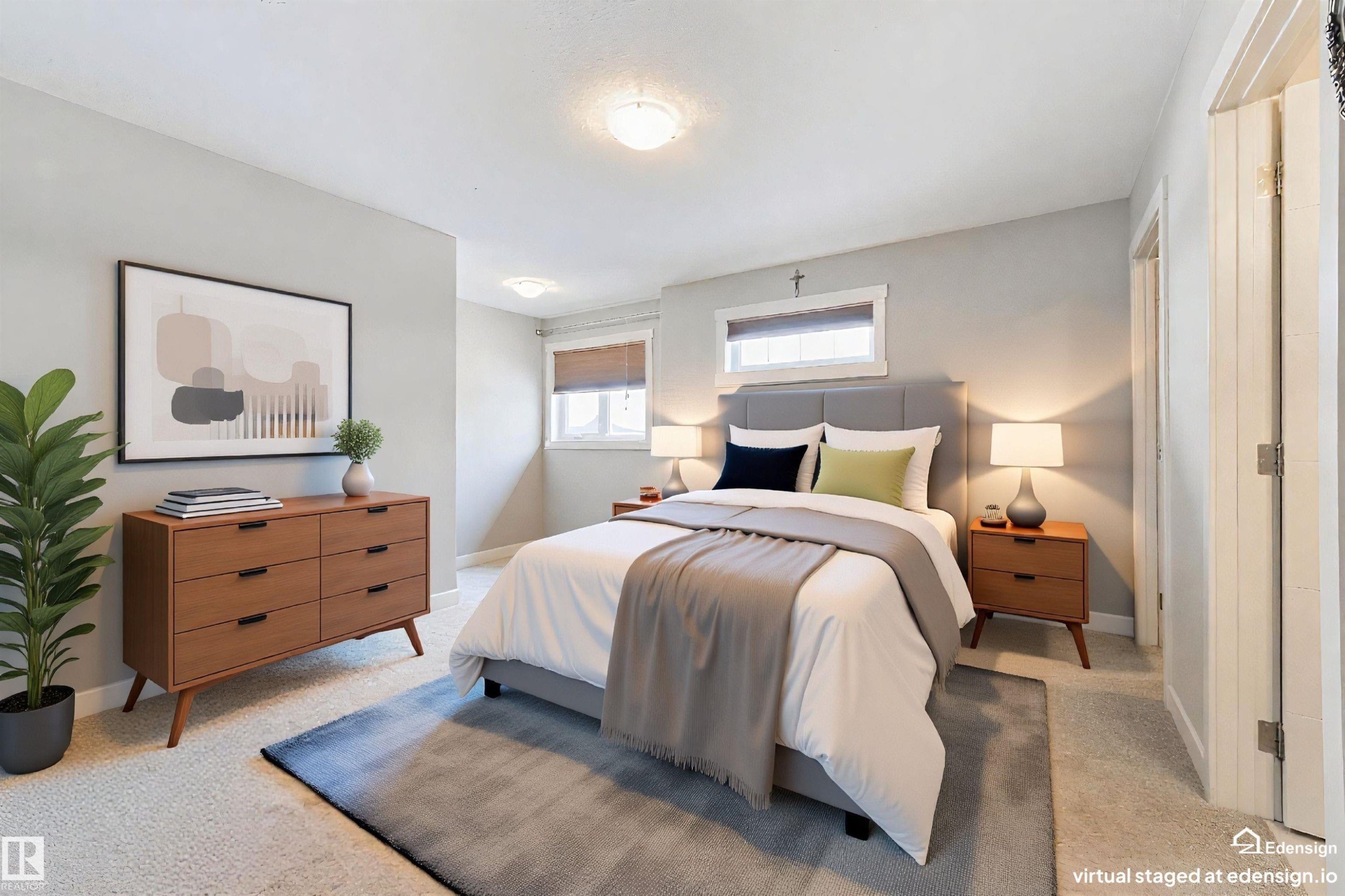Light-filled bedroom featuring soft gray wall tones and plush carpeting - 4914 47 Street, Redwater, AB - Indoor Photo Showing Bedroom
