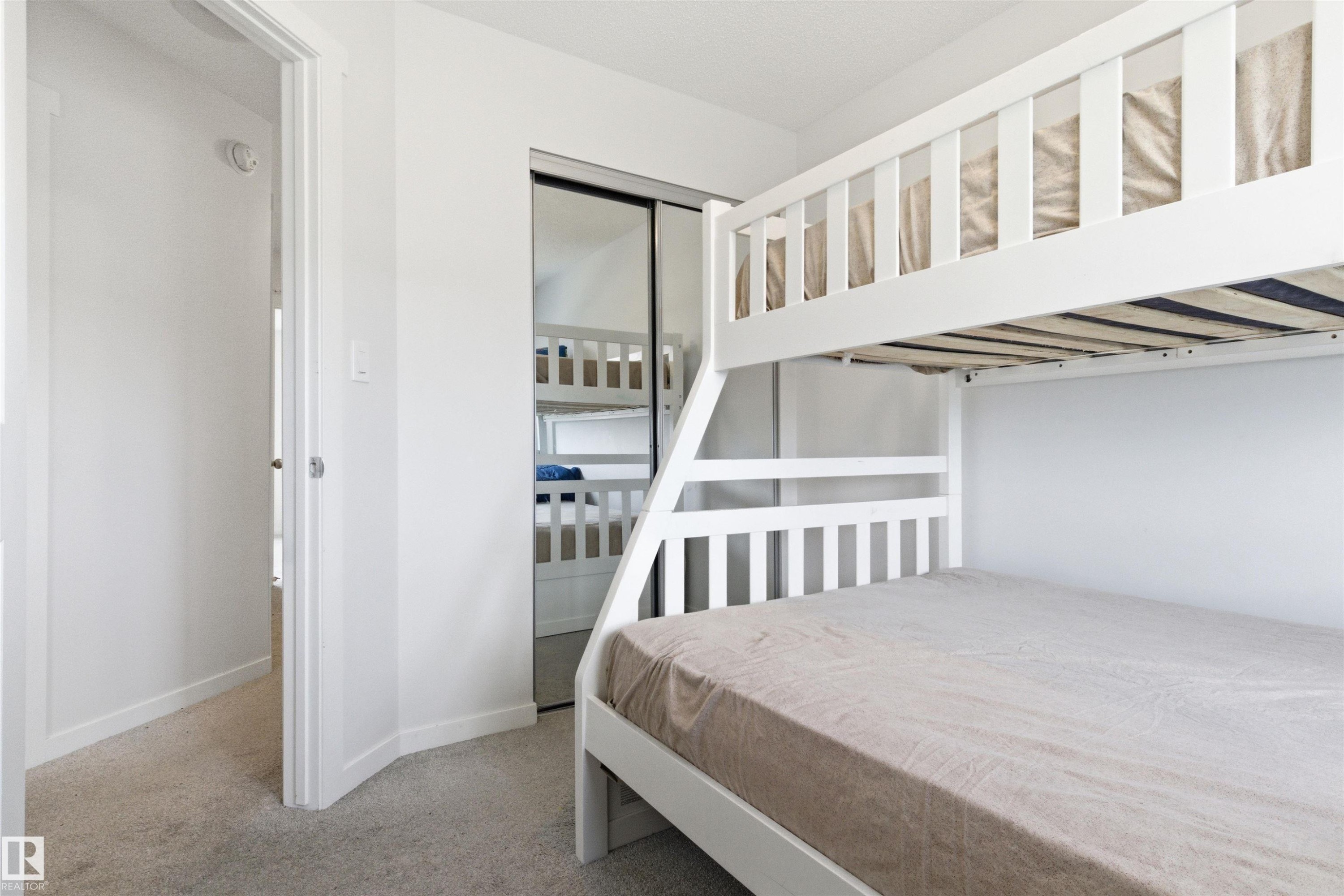 Bedroom featuring light gray carpet flooring and white walls - 9 850 Secord Boulevard, Edmonton, AB - Indoor Photo Showing Bedroom
