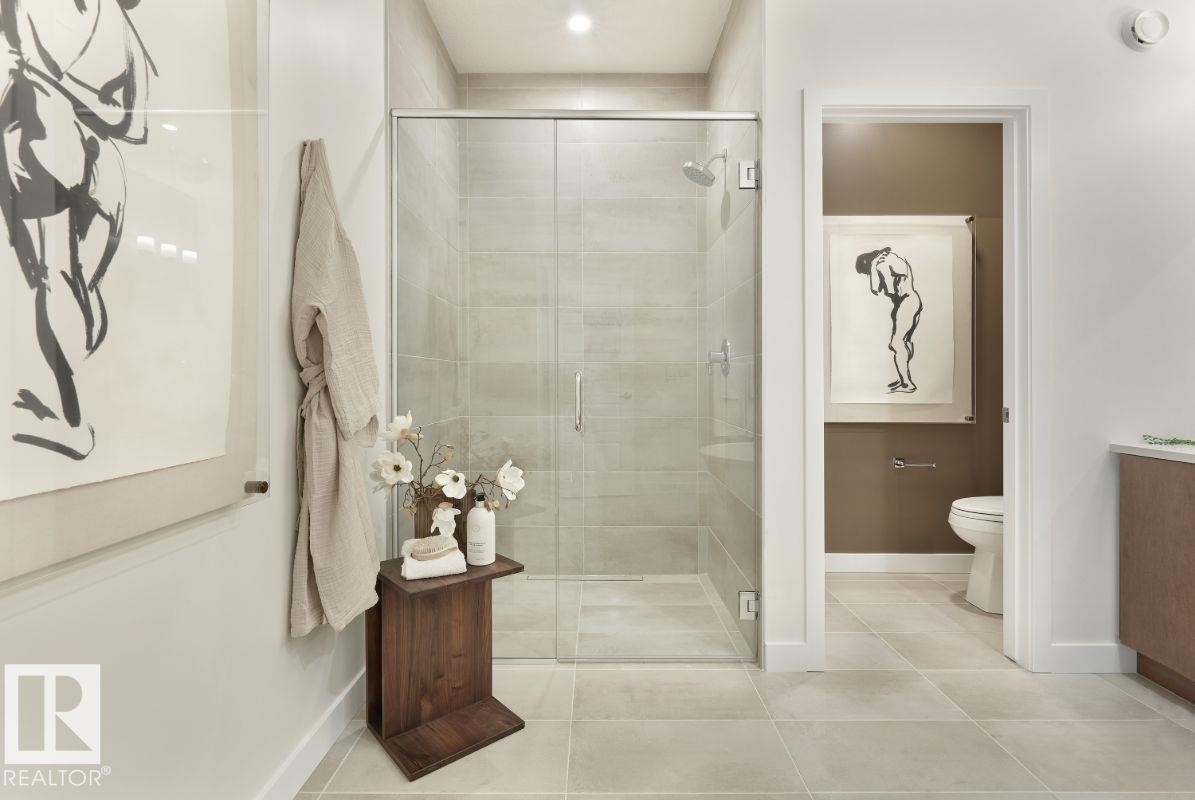Bathroom with light tile patterned floors and a shower stall - 2131 194 Street Nw, Edmonton, AB - Indoor Photo Showing Bathroom