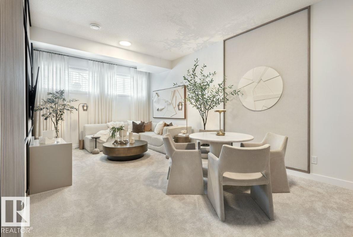 Living area with light carpet and a textured ceiling - 2131 194 Street Nw, Edmonton, AB - Indoor