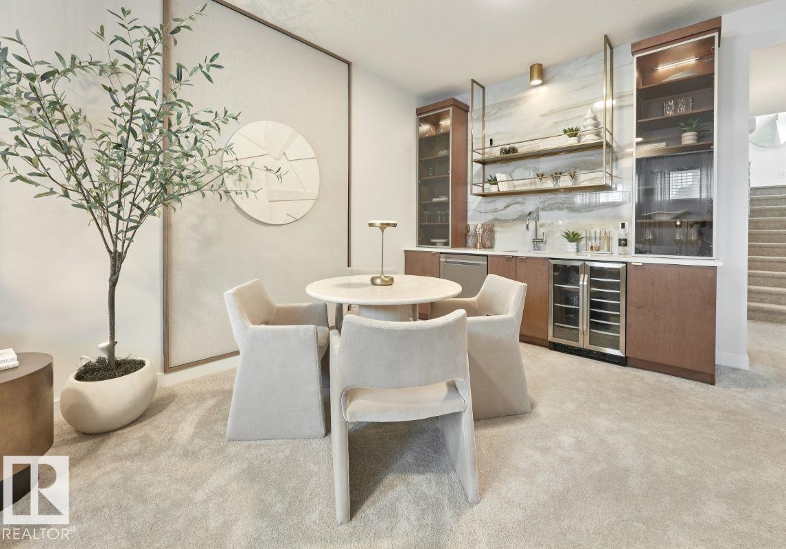 Indoor wet bar featuring beverage cooler, modern cabinets, glass insert cabinets, open shelves, and light carpet - 2131 194 Street Nw, Edmonton, AB - Indoor Photo Showing Dining Room