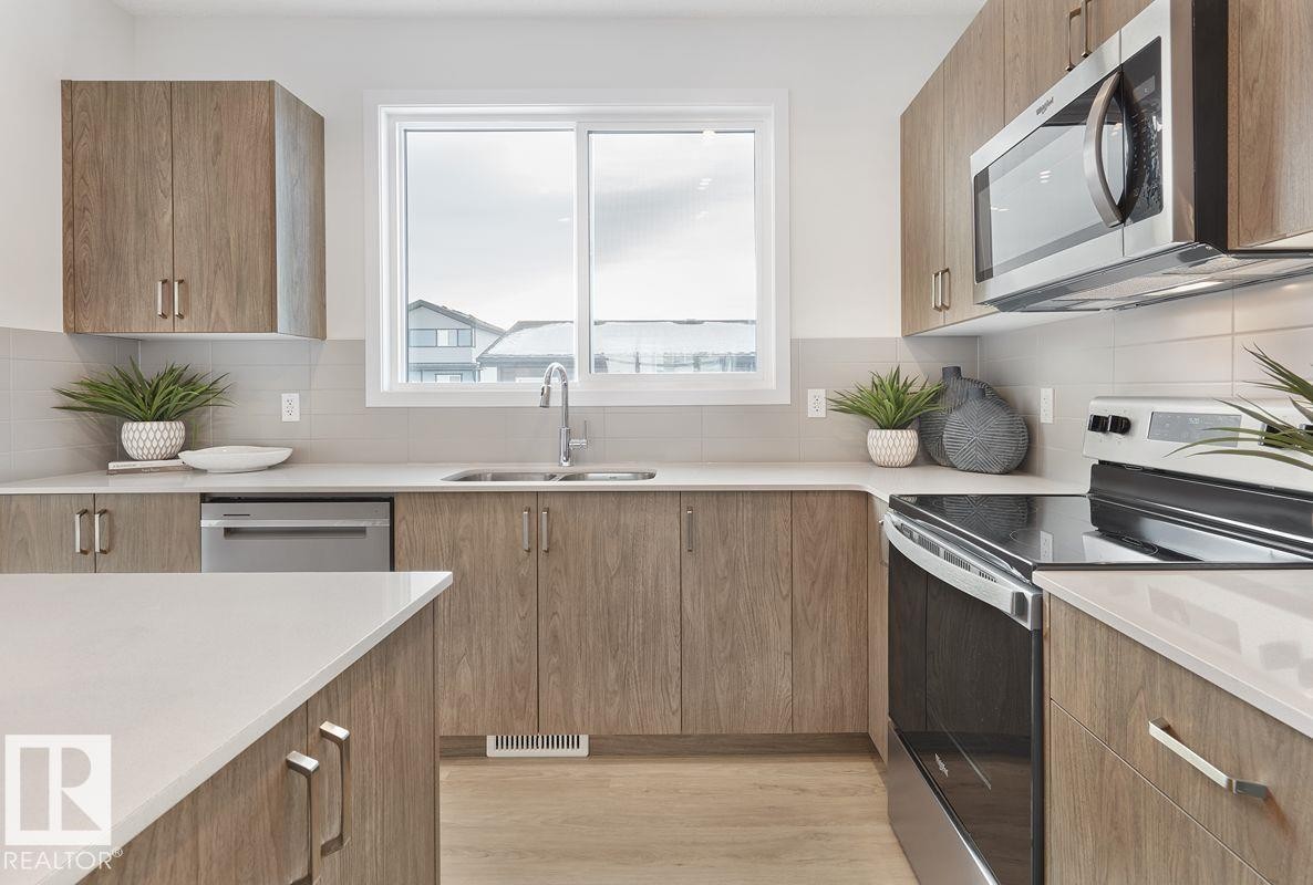 307 173 Avenue Nw, Edmonton, AB - Indoor Photo Showing Kitchen With Double Sink