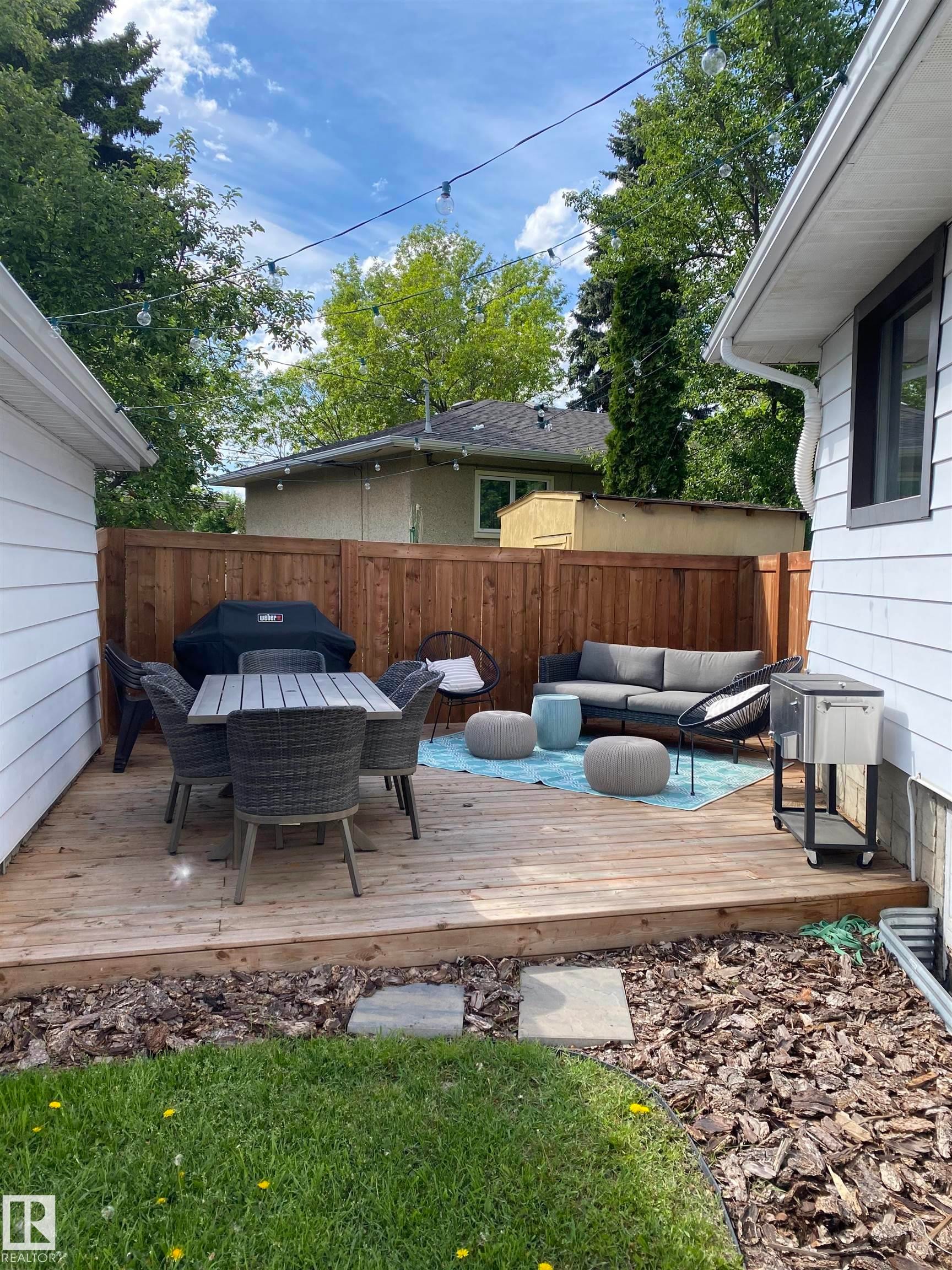 Expansive wood deck with a full privacy fence - 8239 93A Avenue, Edmonton, AB - Outdoor With Deck Patio Veranda With Exterior