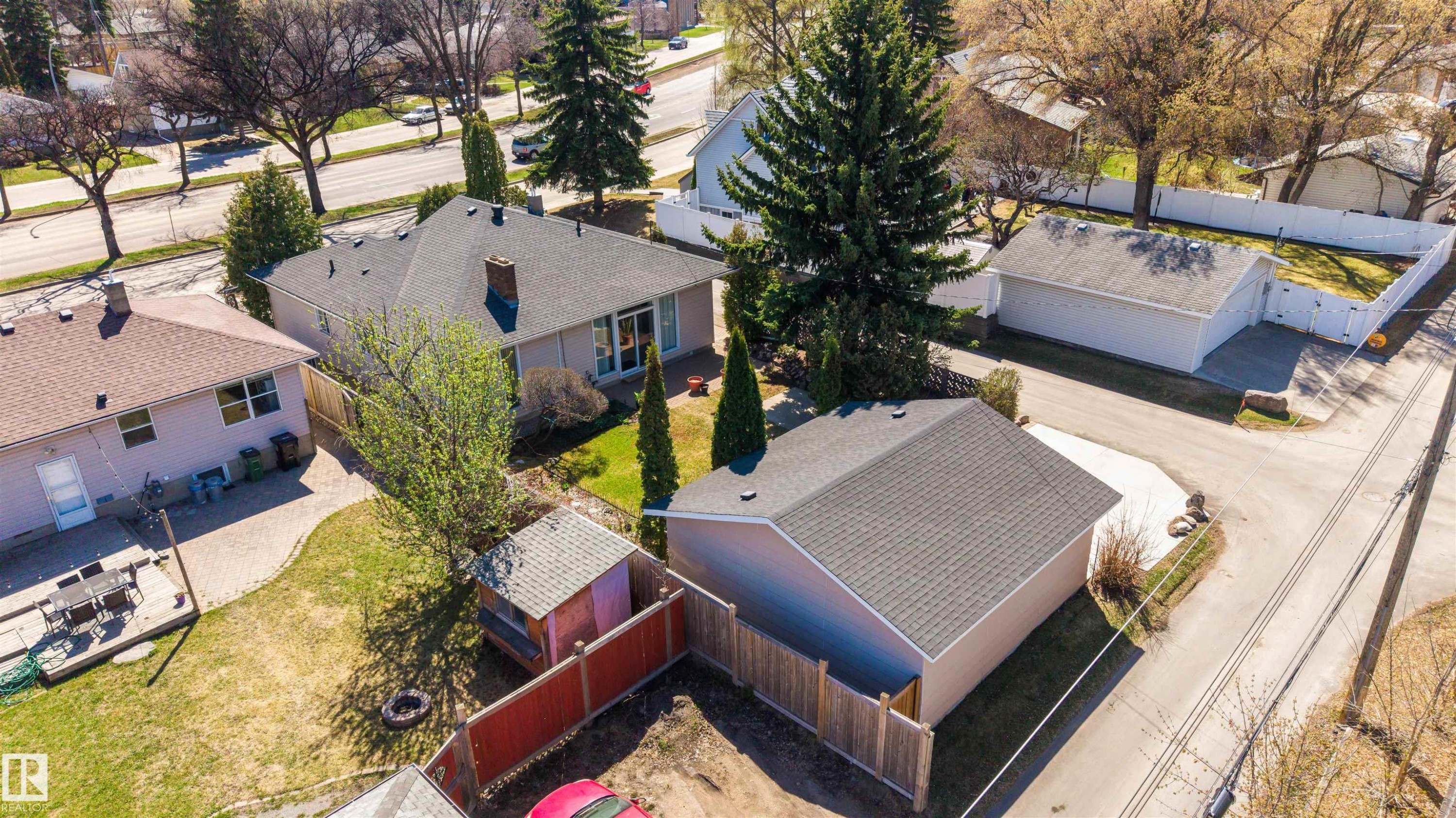 Aerial perspective showcasing a single-story residence with a dark shingle roof and a separate detached garage structure - 9602 85 Street, Edmonton, AB