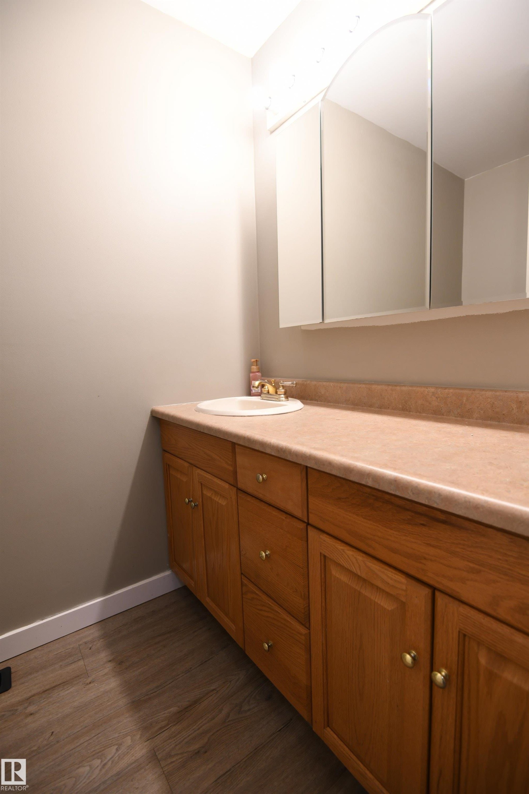 The main floor holds a nicely sized 2 piece bathroom, set away from the family spaces, near the front entrance. Great counter space. A full 4 piece bathroom serves the bedrooms on the second level as well - 6706 36A Avenue, Edmonton, AB - Indoor Photo Showing Bathroom