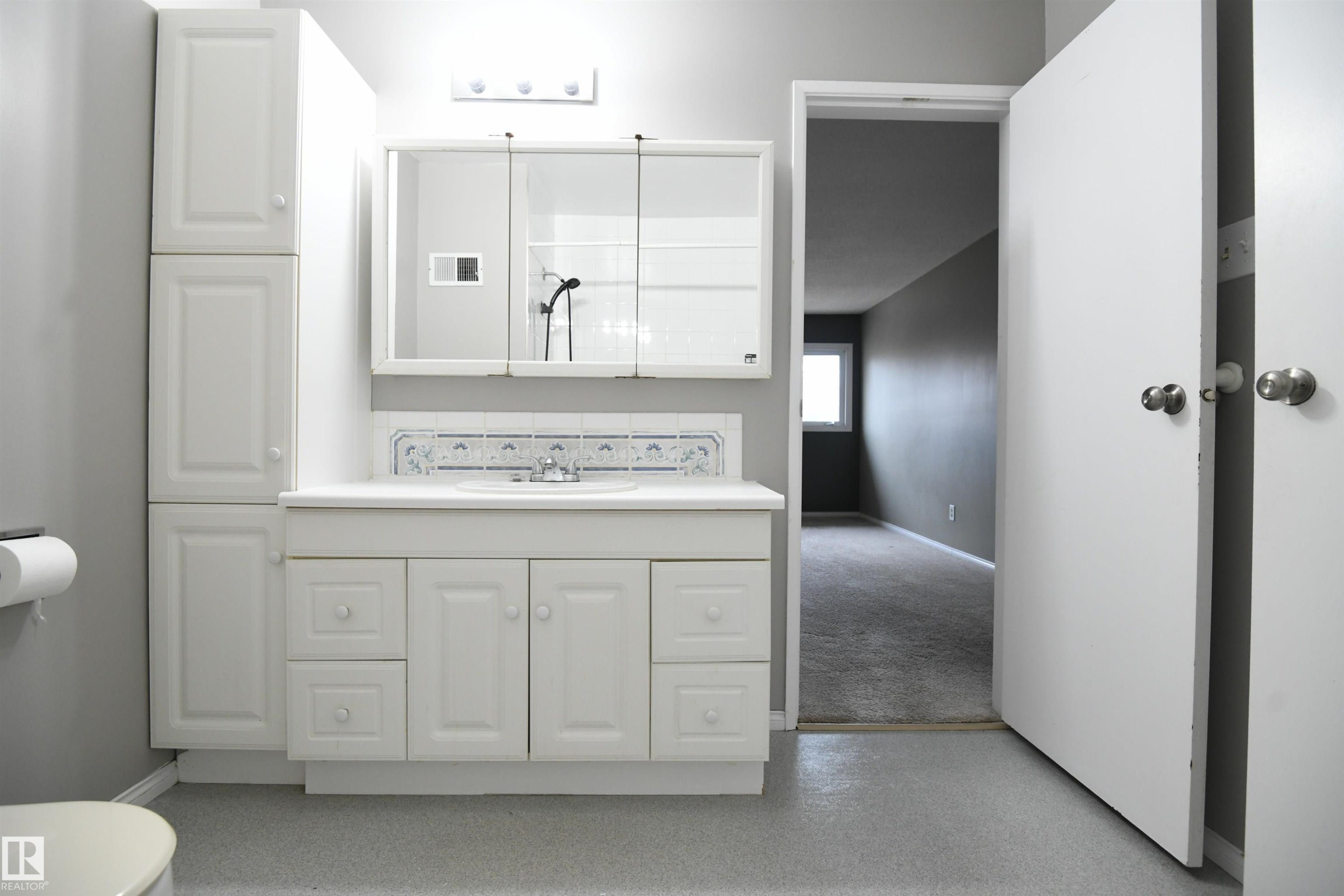 The main bathroom on the top floor serves both the 2nd and 3rd bedrooms via the hallway door, but also doubles as a private ensuite for the master bedroom, via it's own private door. Another nice touch - 6706 36A Avenue, Edmonton, AB - Indoor Photo Showing Bathroom