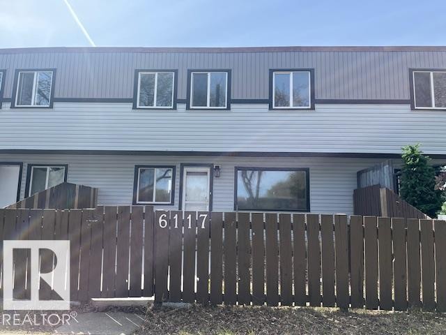 Two-story townhome featuring light blue and dark gray siding - 6117 120 Avenue, Edmonton, AB - Outdoor