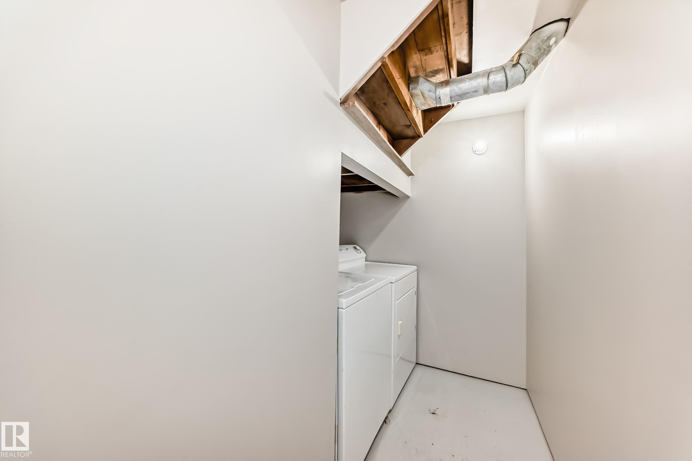 Laundry area with white walls and a white floor - 10329 150 Street, Edmonton, AB - Indoor Photo Showing Laundry Room