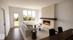 Living area featuring wood-finish flooring, a contemporary built-in fireplace with a dark wood mantel, and large windows providing abundant illumination -