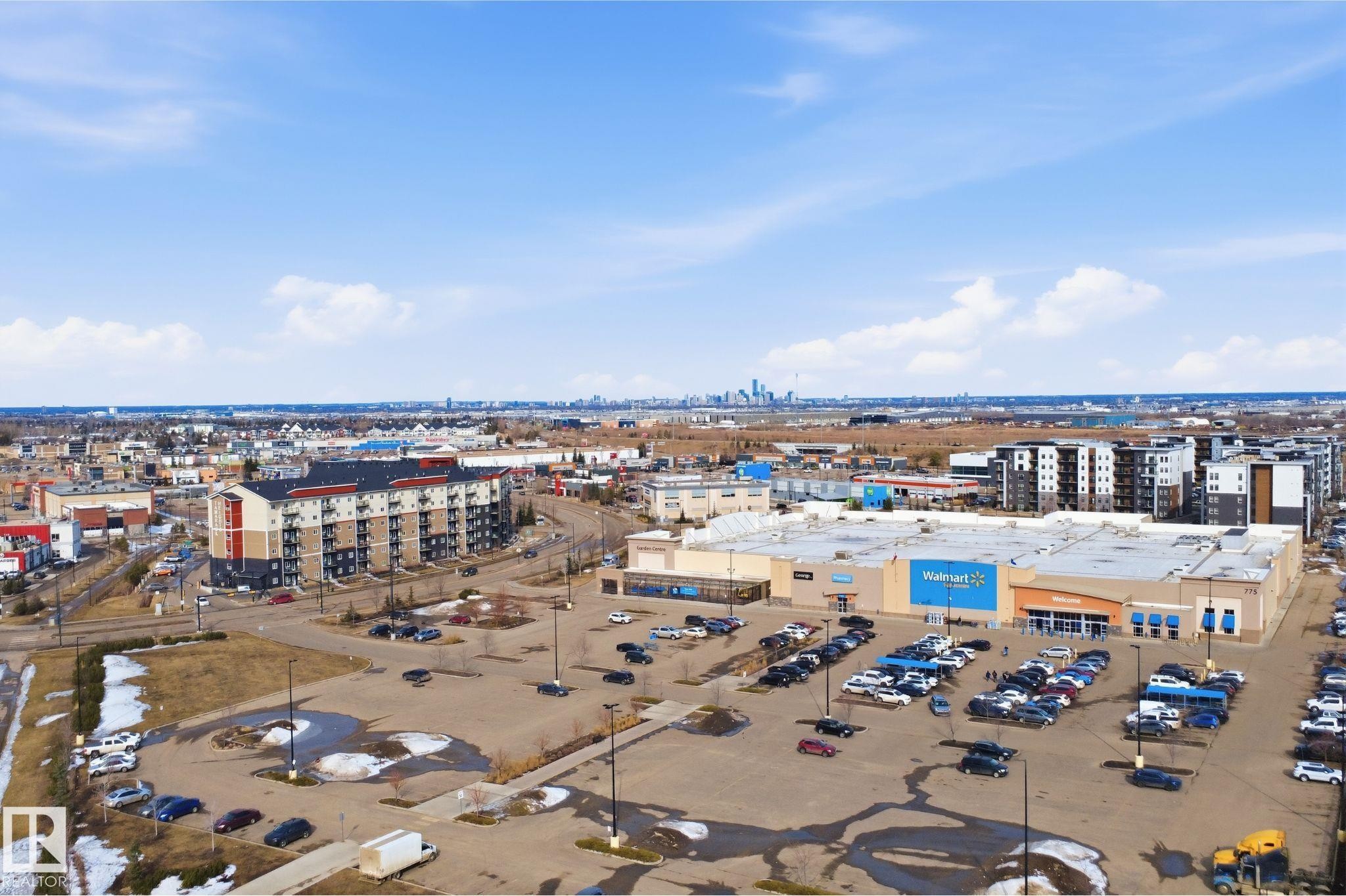 Aerial view showcasing the surrounding neighborhood with commercial establishments and residential buildings - 2125 Maple Road Nw, Edmonton, AB - Outdoor With View