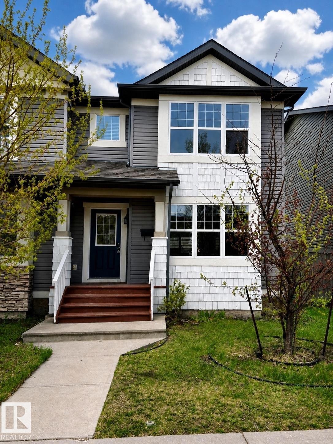 Contemporary exterior with varied siding textures - 2143 32 Street, Edmonton, AB
