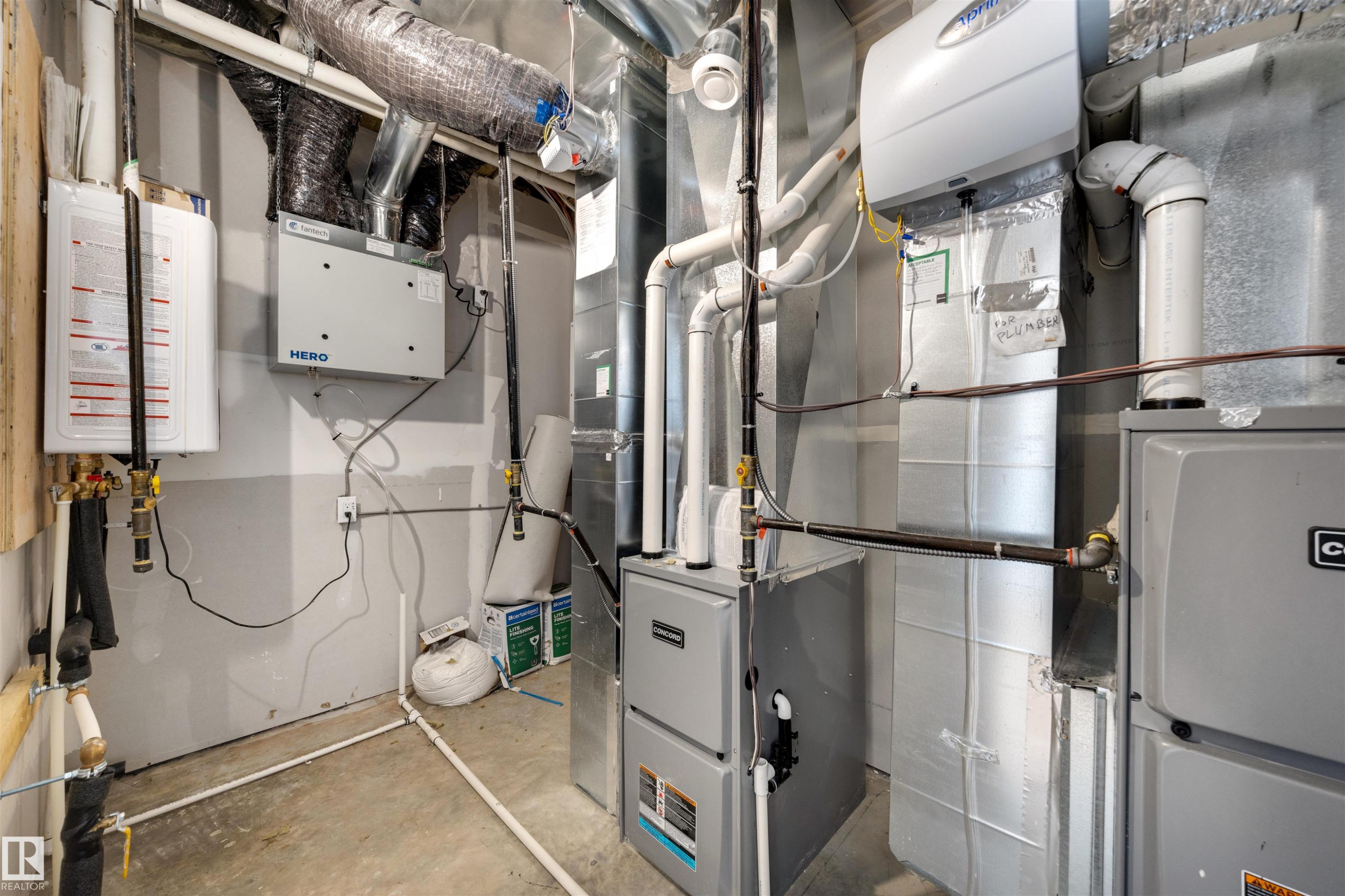 The property features a comprehensive utility area with a water heater, furnace, and extensive ductwork, ensuring efficient operation - 7927 112S Avenue, Edmonton, AB - Indoor Photo Showing Basement